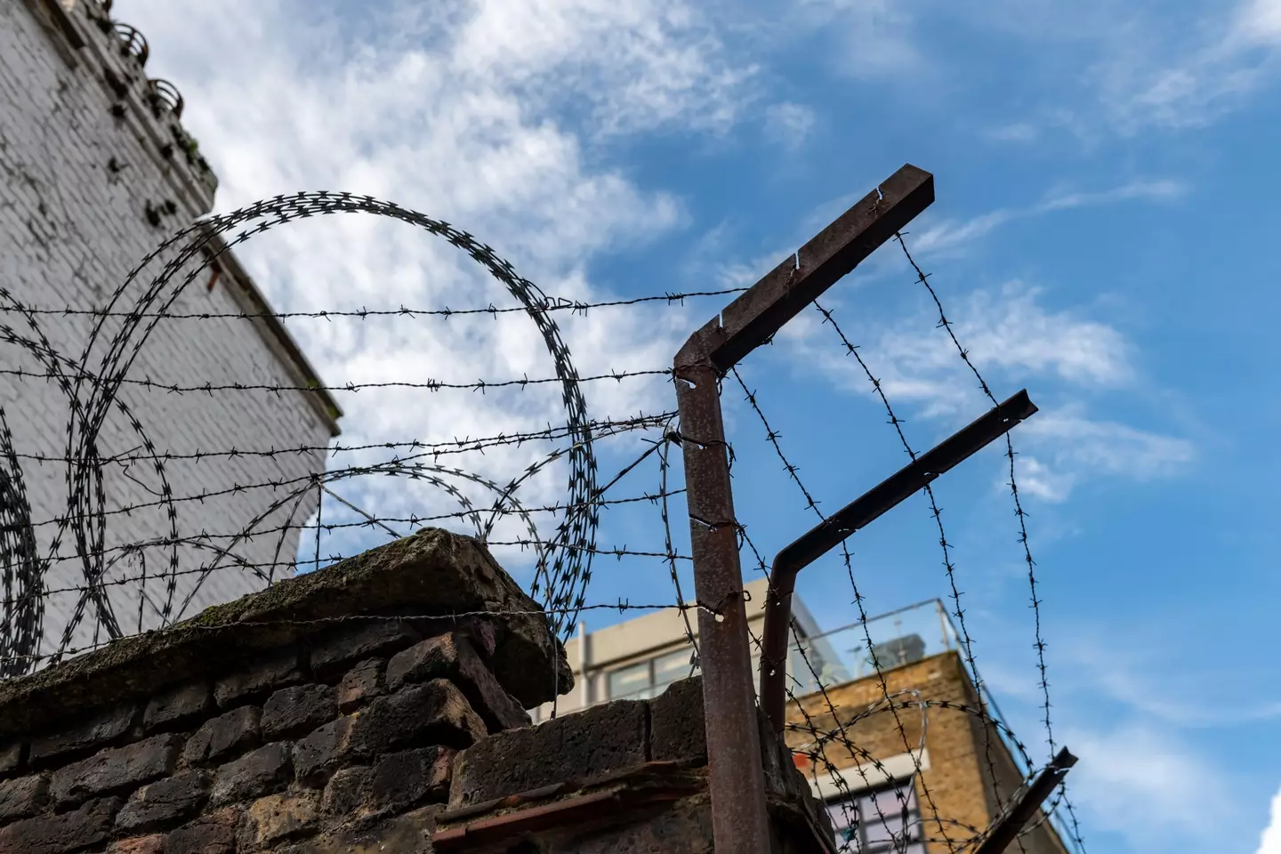 Prison wall and wire.