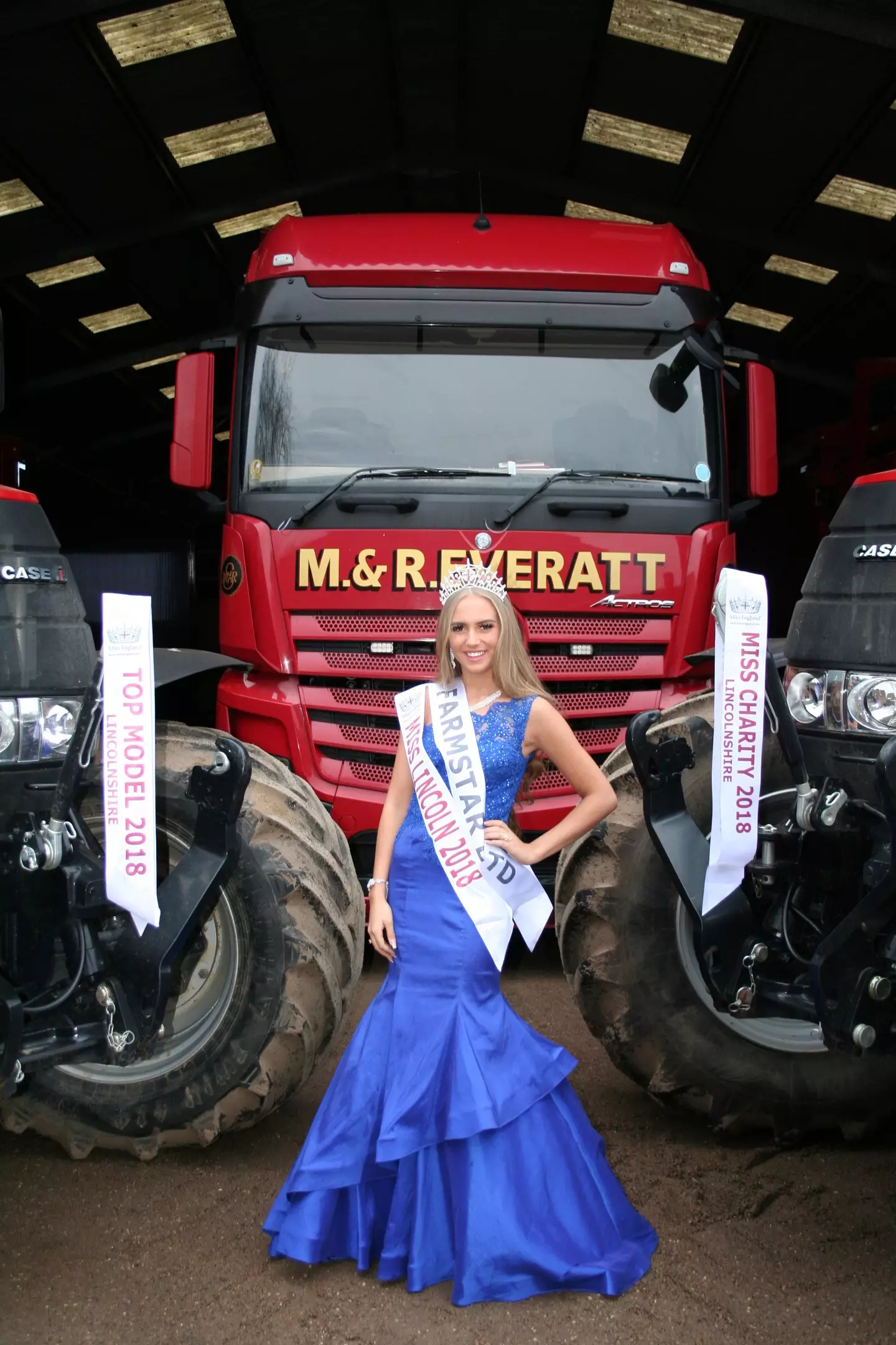 Miss England finalist Milly Everatt in front of lorry (SWNS)