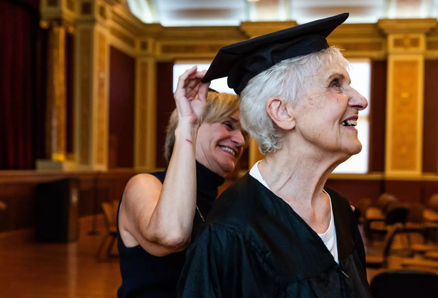 Joyce, trying on her graduation garb.