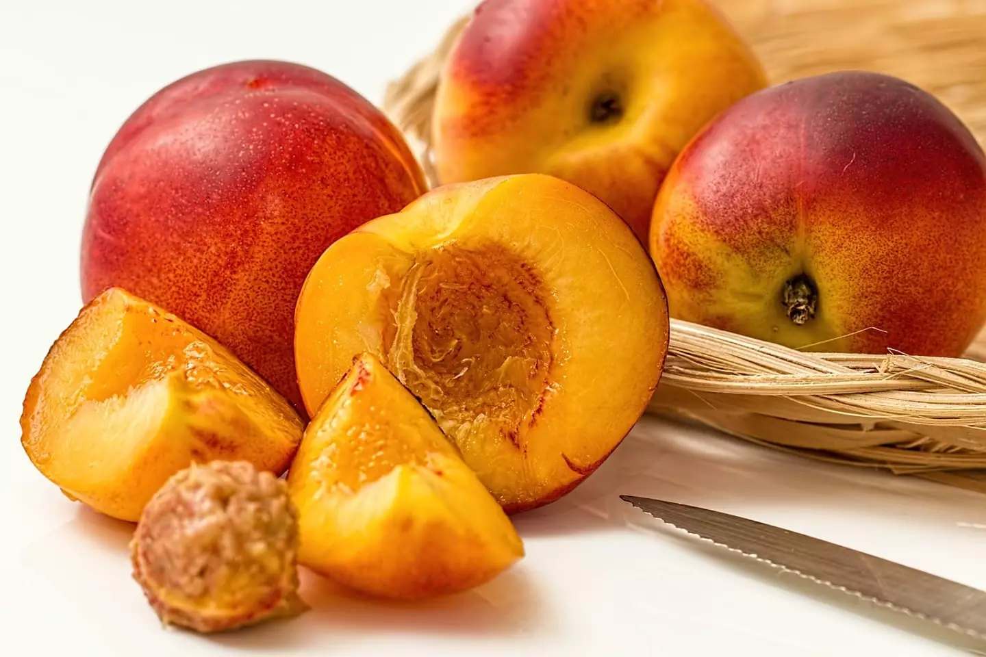 Peaches are characterised as drupes because of their fleshing layer an shell.