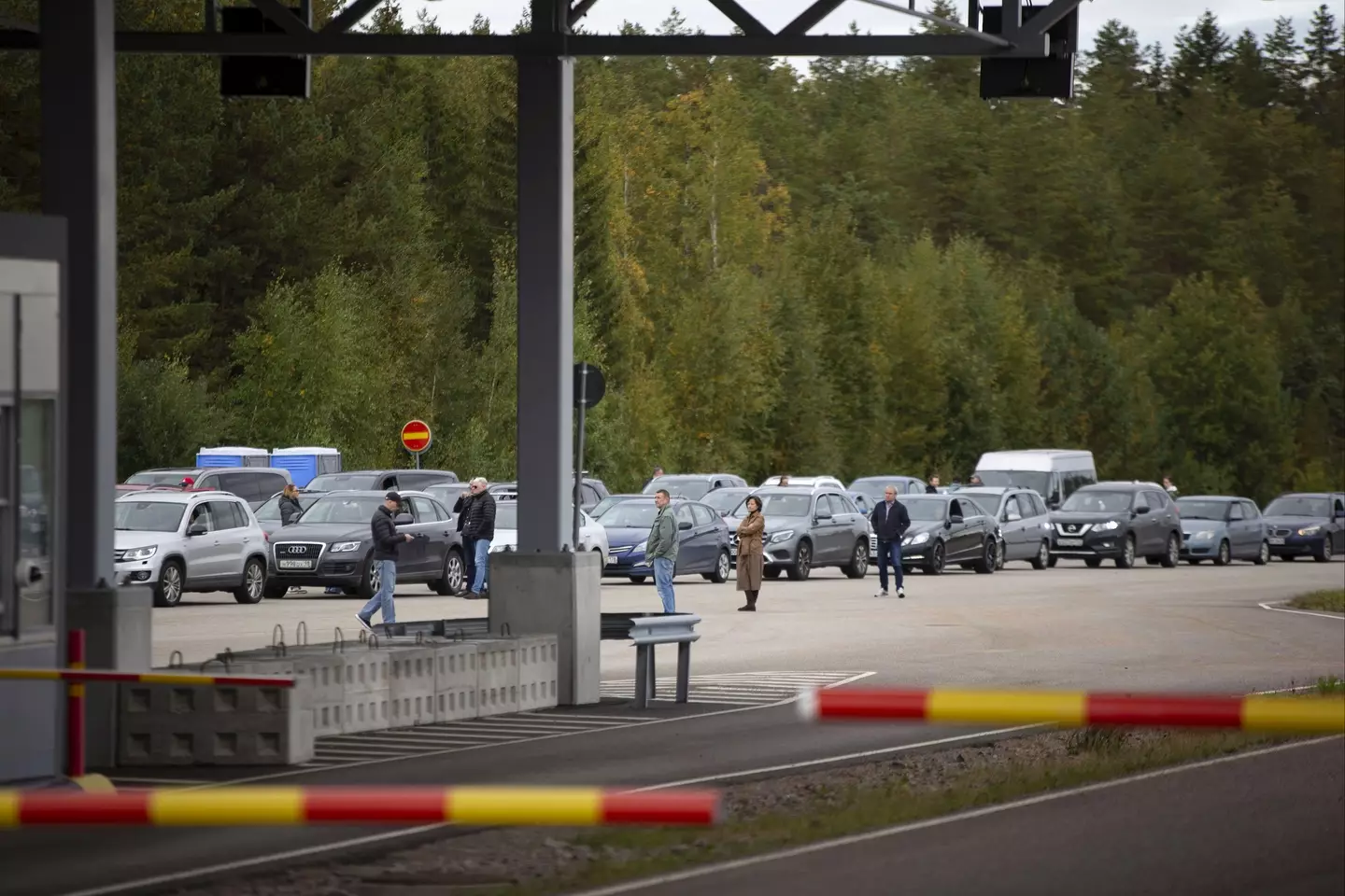 The queue of cars on the Russian border with Finland goes back for miles.