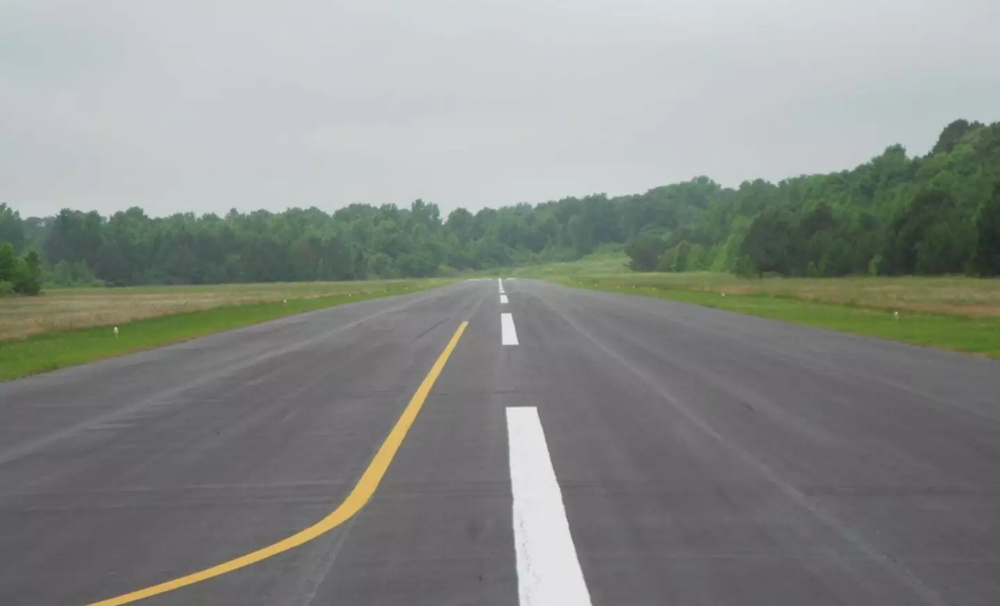 Samantha Hayes was riding the lawnmower by the runway.