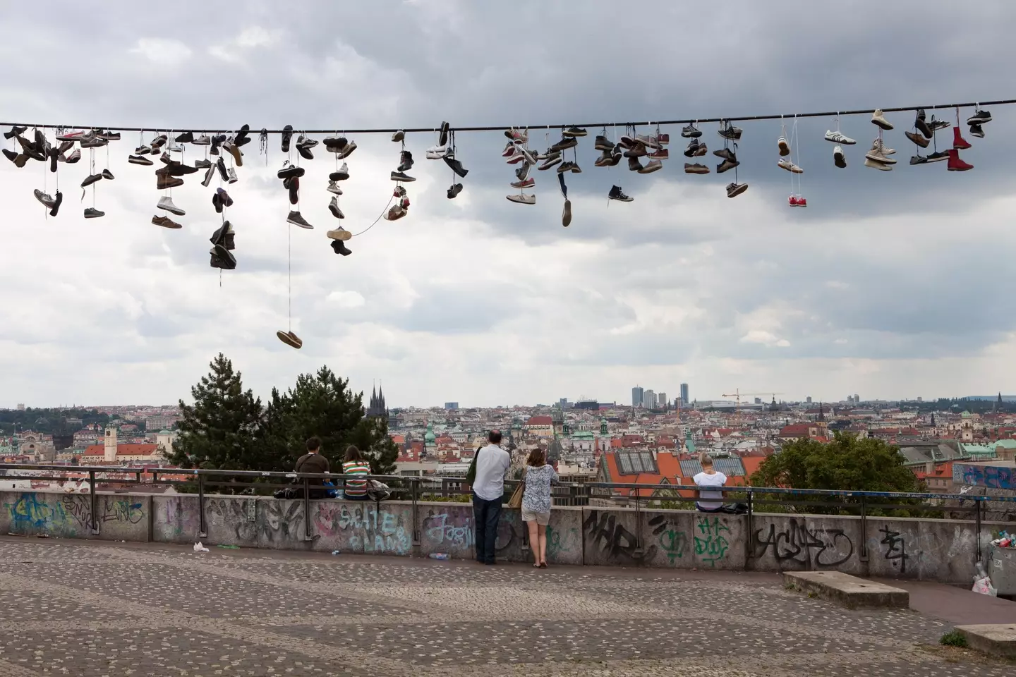 Have you ever wondered why people throw shoes on power lines? (Eric Kruszewski/Design Pics Editorial/Universal Images Group via Getty Images)