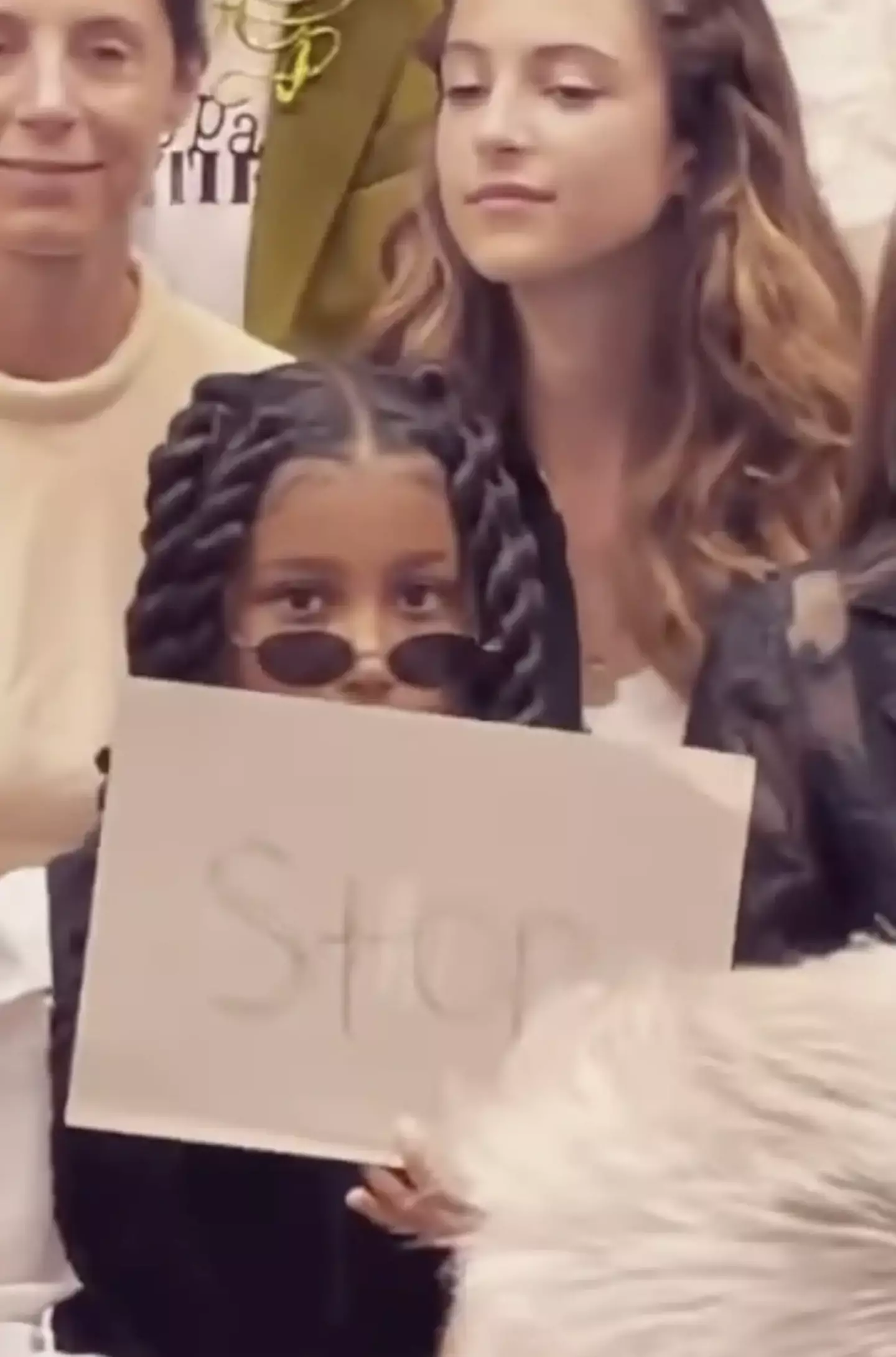 North held up a sign that read ‘stop’ at the Jean Paul Gaultier Haute Couture show.