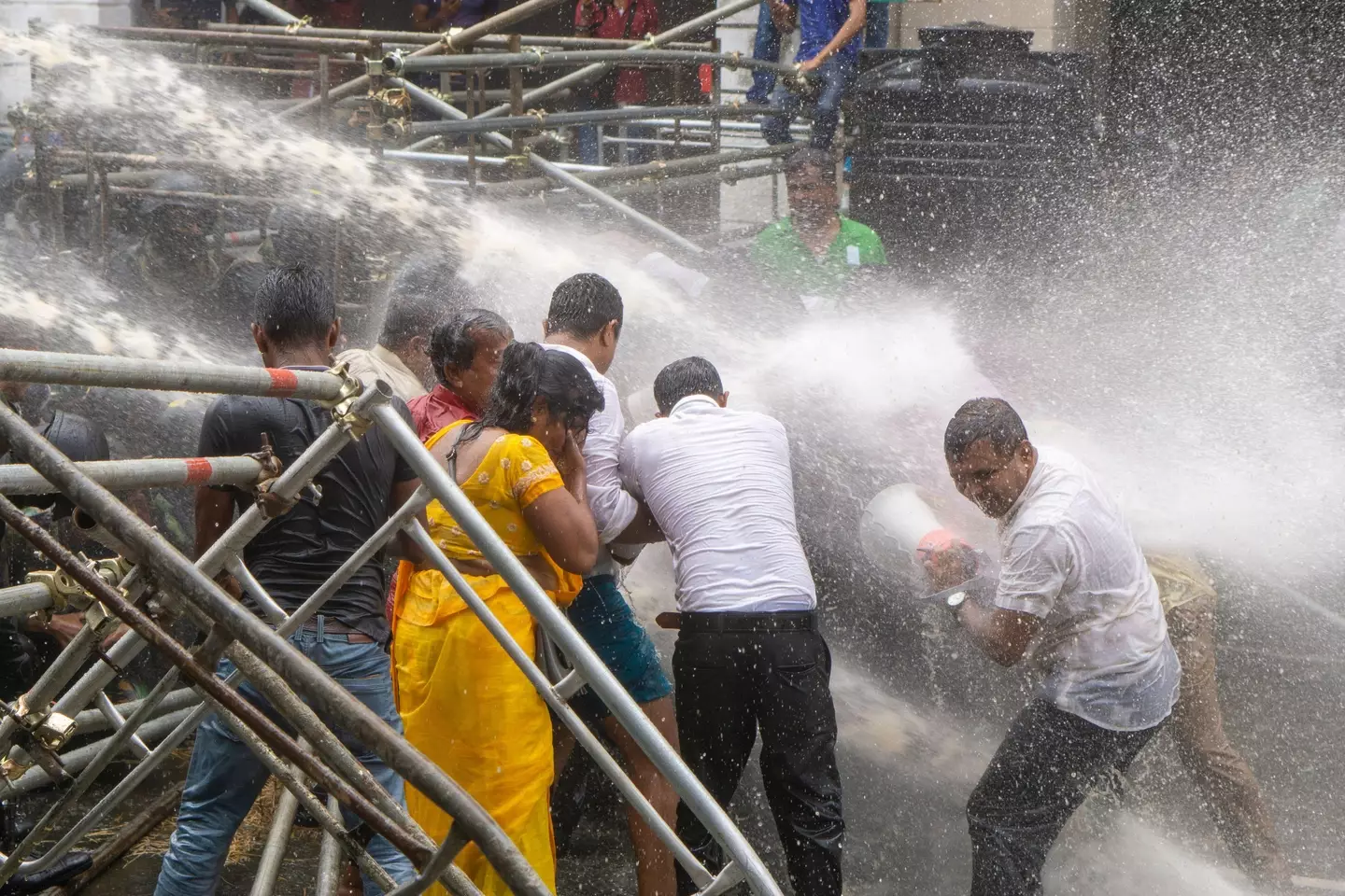 Sri Lankan protesters were repelled from the area around the presidential house with water cannons on July 6.