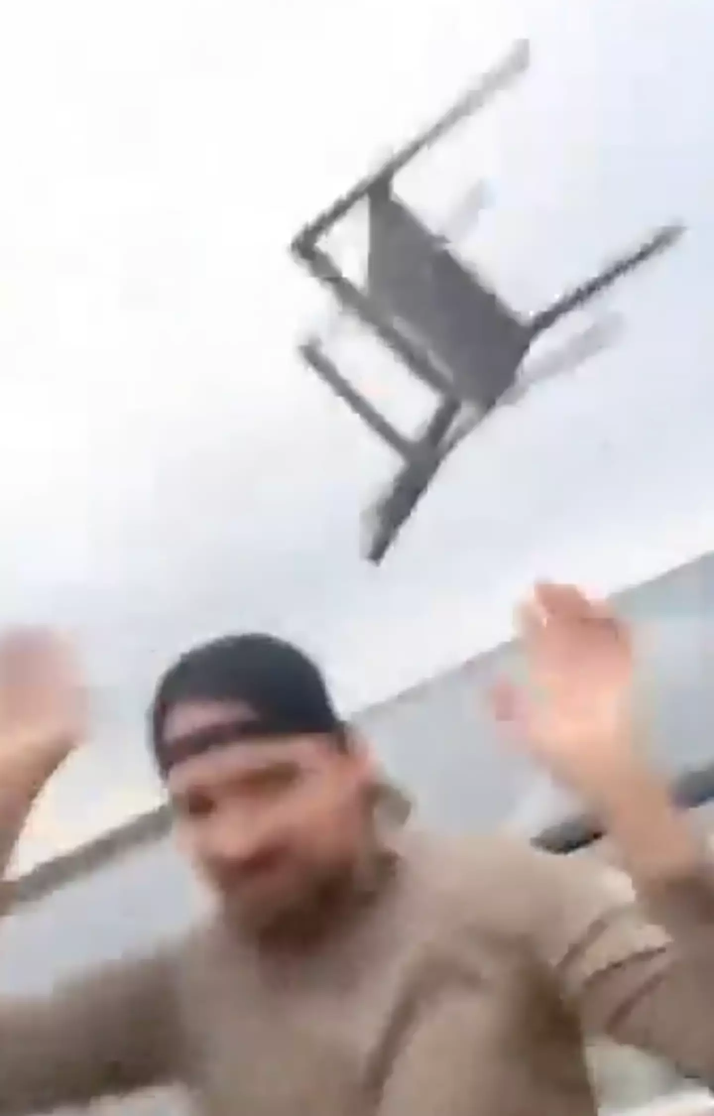 Chairs can be seen going flying.