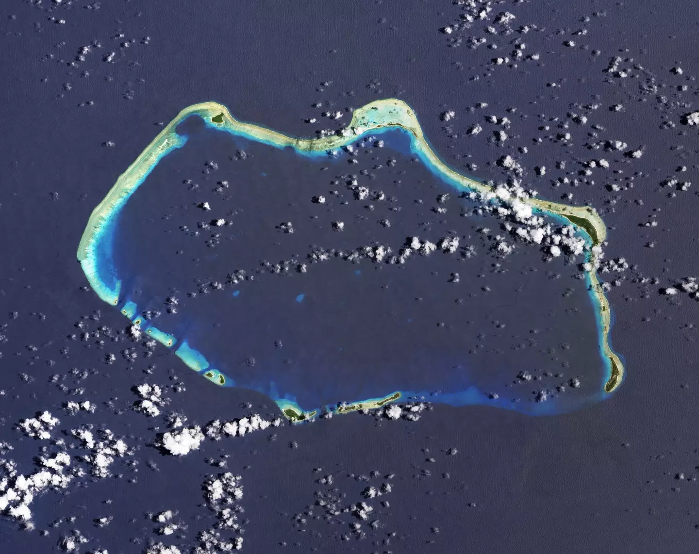 Bikini Atoll, where the US conducted a series of nuclear tests, the part in the upper left where it looks like a chunk is missing is where this 15 megaton bomb was detonated.