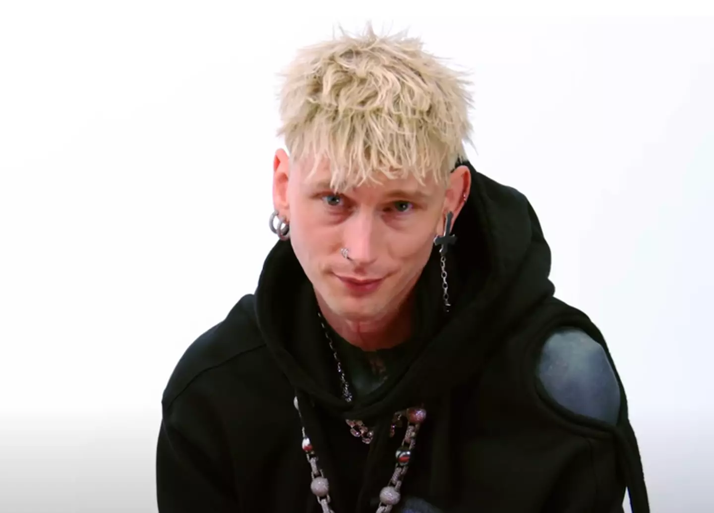 Machine Gun Kelly was smart enough to sidestep a tense moment between himself and the Swifties.(FirstWeFeast/YouTube)