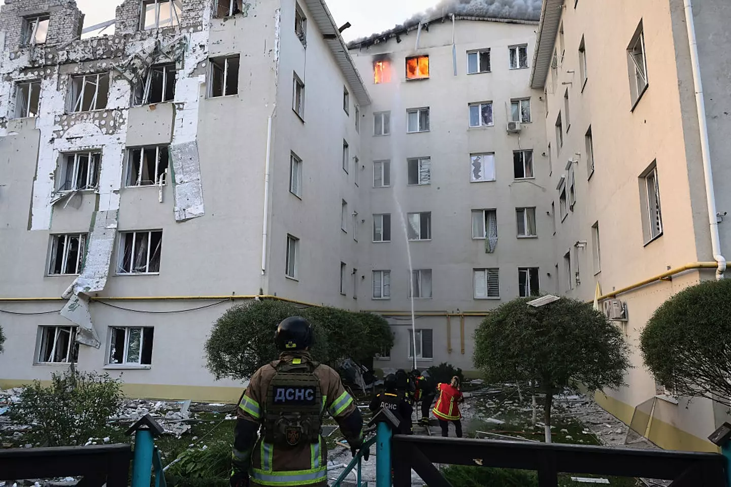 Firefighters extinguish a fire caused by a Russian drone strike on the top floor of a multi-story residential building in Kharkiv, Ukraine, yesterday (Ukrinform/NurPhoto via Getty Images)