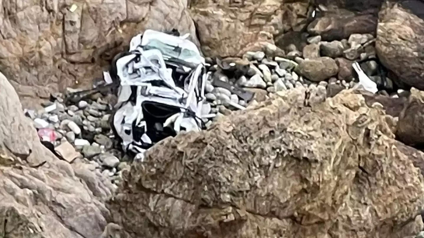 The wife claimed her husband crashed the car off the 300-foot cliff 'on purpose'.