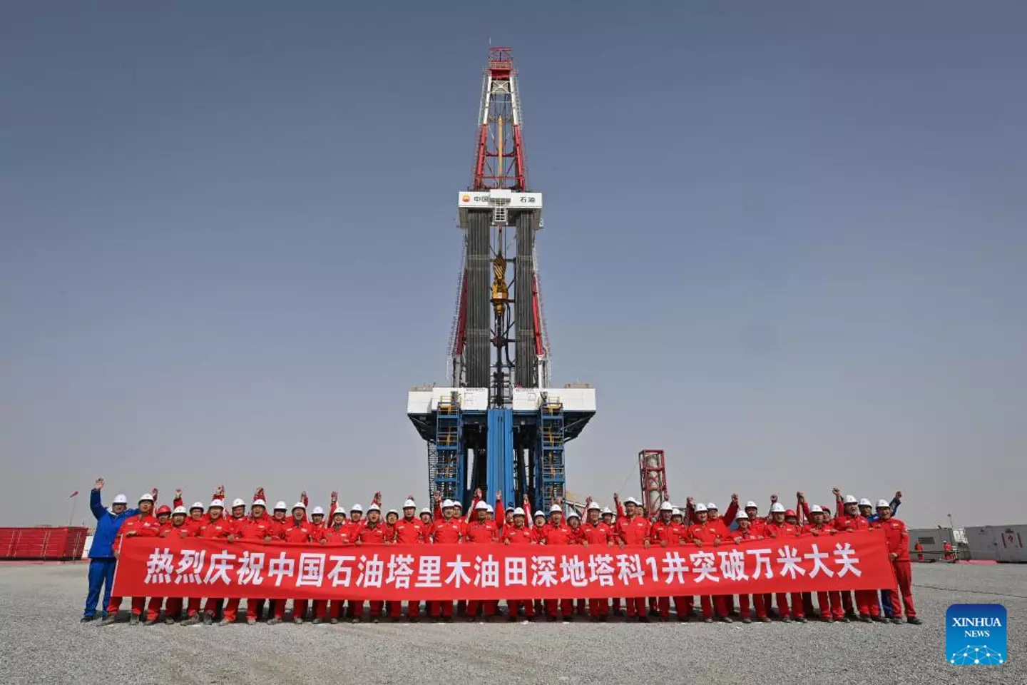 Workers celebrating Shenditake 1's major milestone in May (Xinhua/Li Xiang)