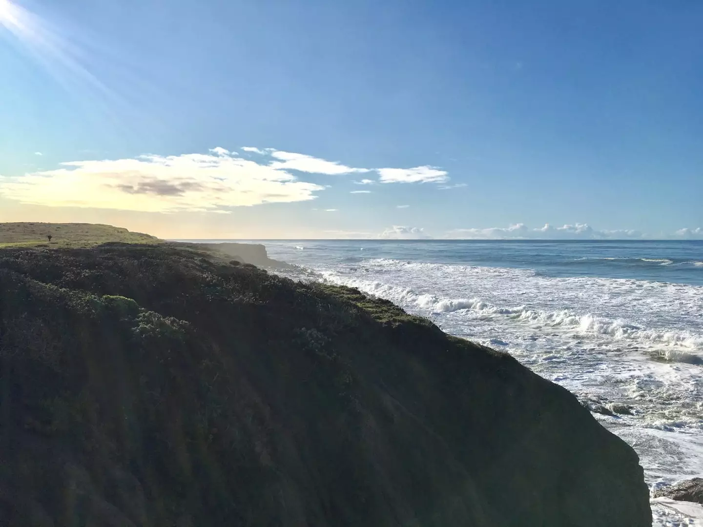 Cliffs in San Simeon, California, slope into the ocean (NASA/JPL-Caltech)