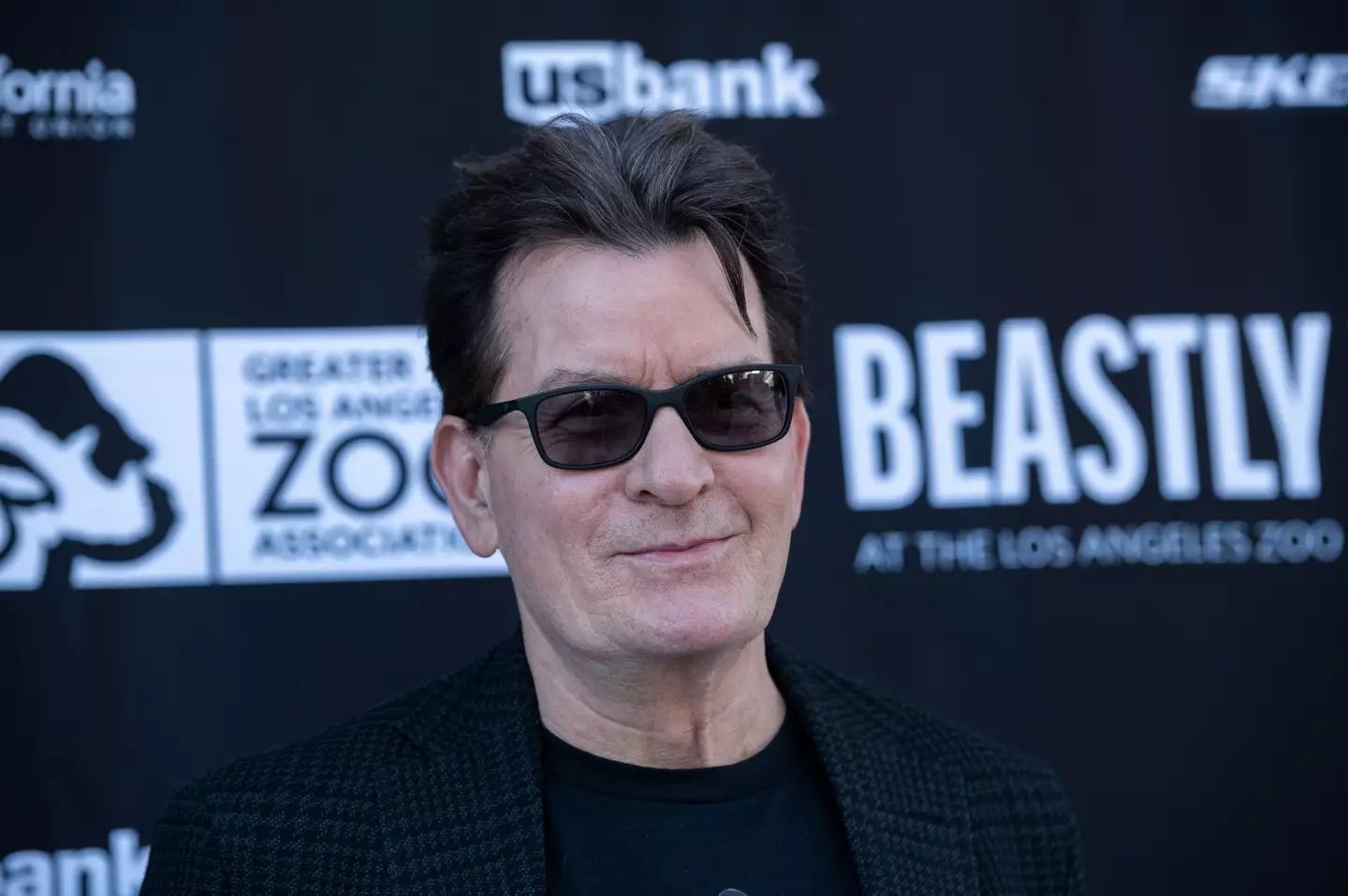 Charlie Sheen's neighbor has been arrested on suspicion of attacking the actor.