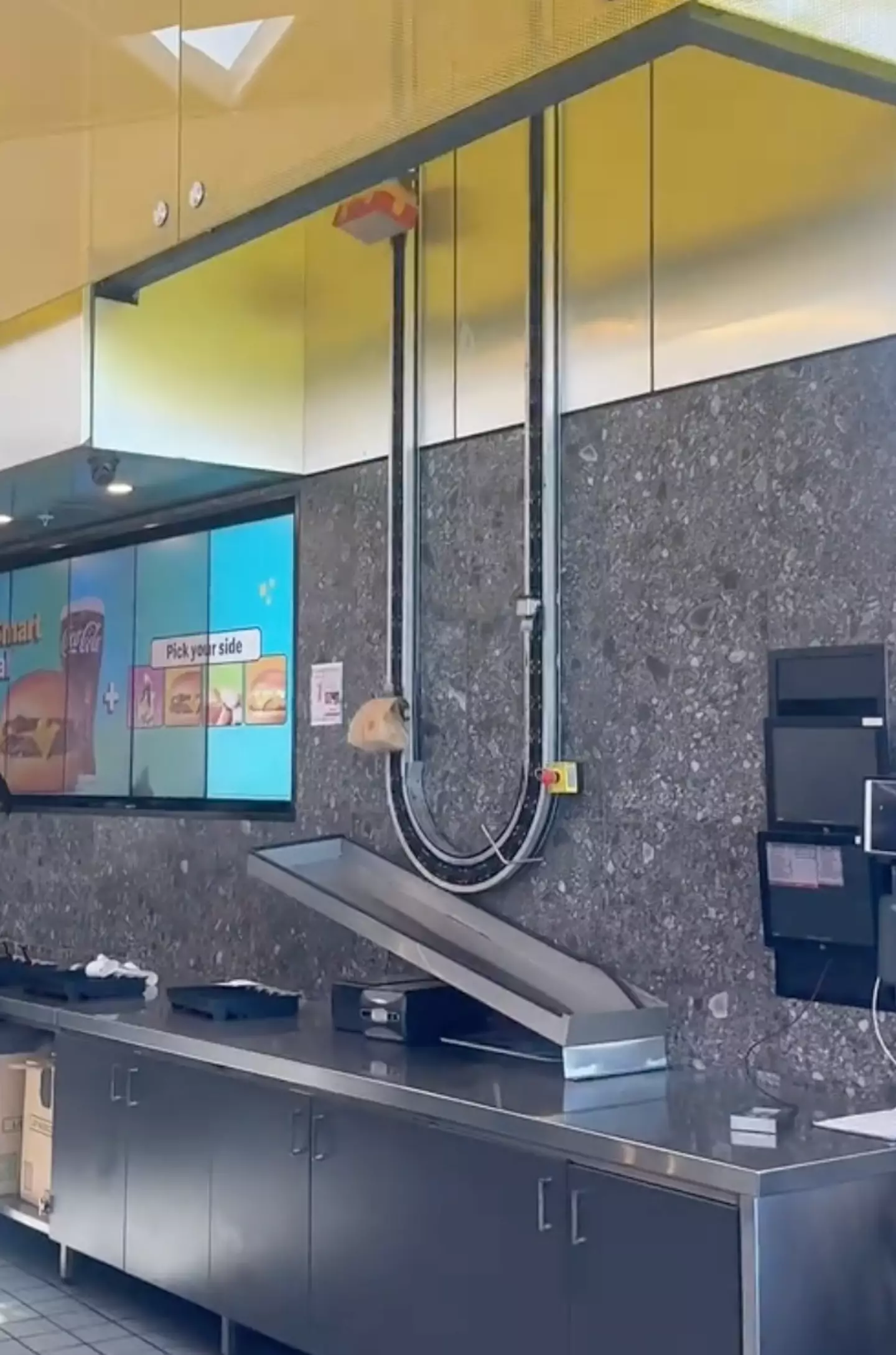 The Aussie-based McDonald's delivers orders by conveyor belt (TikTok/@eloisefouladgar)