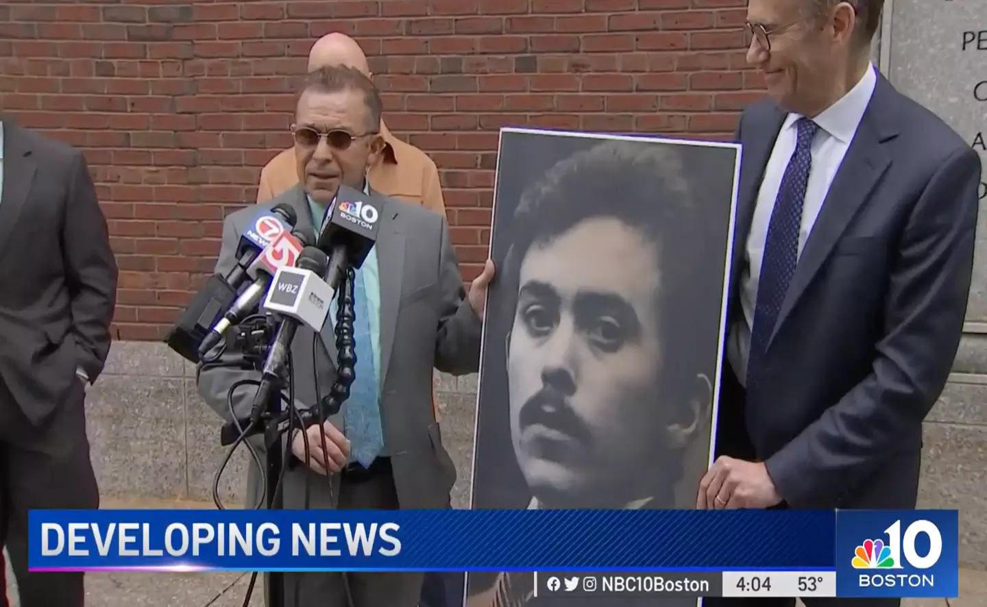 Rosario posed with a picture of himself as a 24-year-old in court.