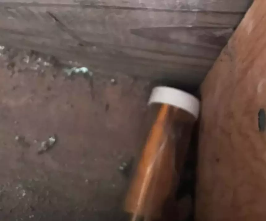 The note was hidden in a hole in the wall.