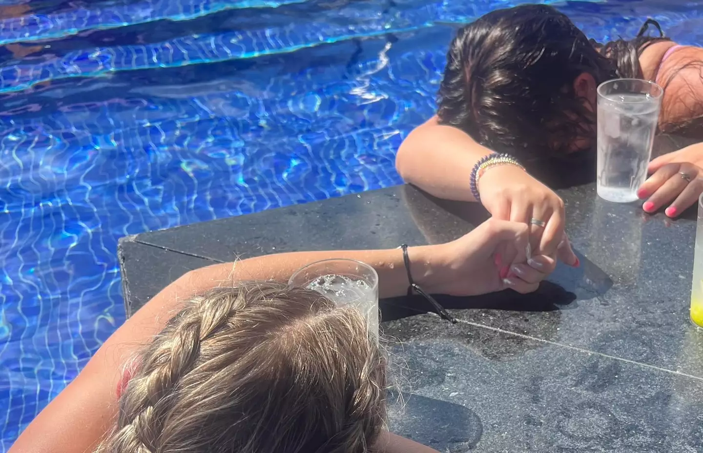 A photo shows Zara and Kaylie seemingly passed out the swim-up bar. (Facebook/Rilee Works)