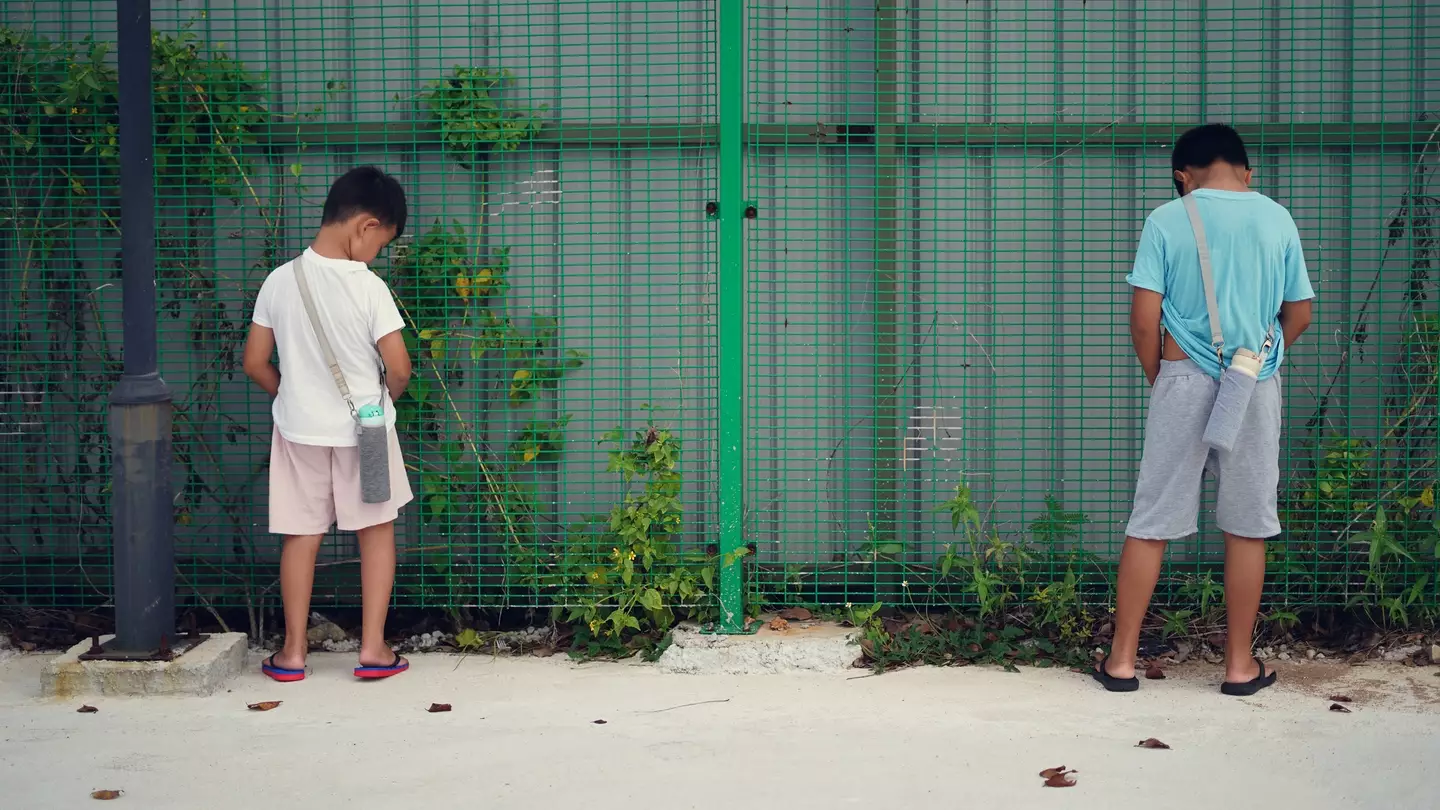 A new TikTok trend sweeping across schools in the US involves kids 'peeing' on school property (Getty stock)