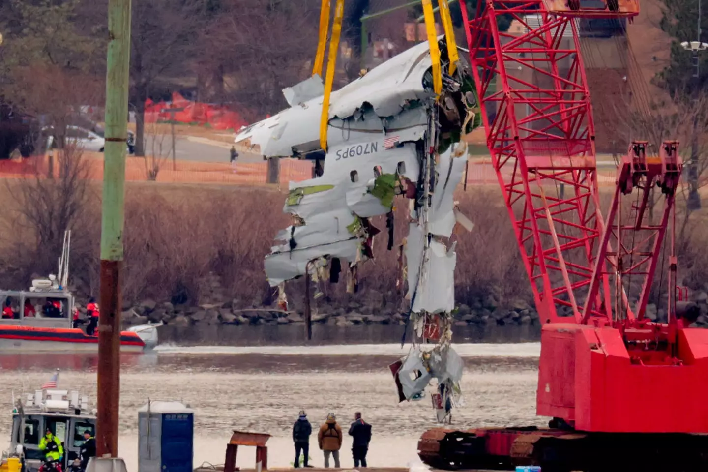 A large portion of the damaged plane fuselage lifted from the Potomac River (Chip Somodevilla/Getty Image