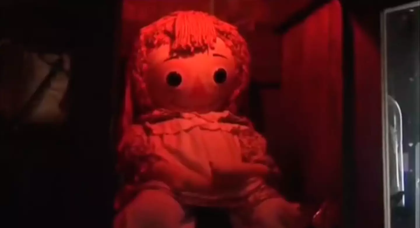 The doll in its container.