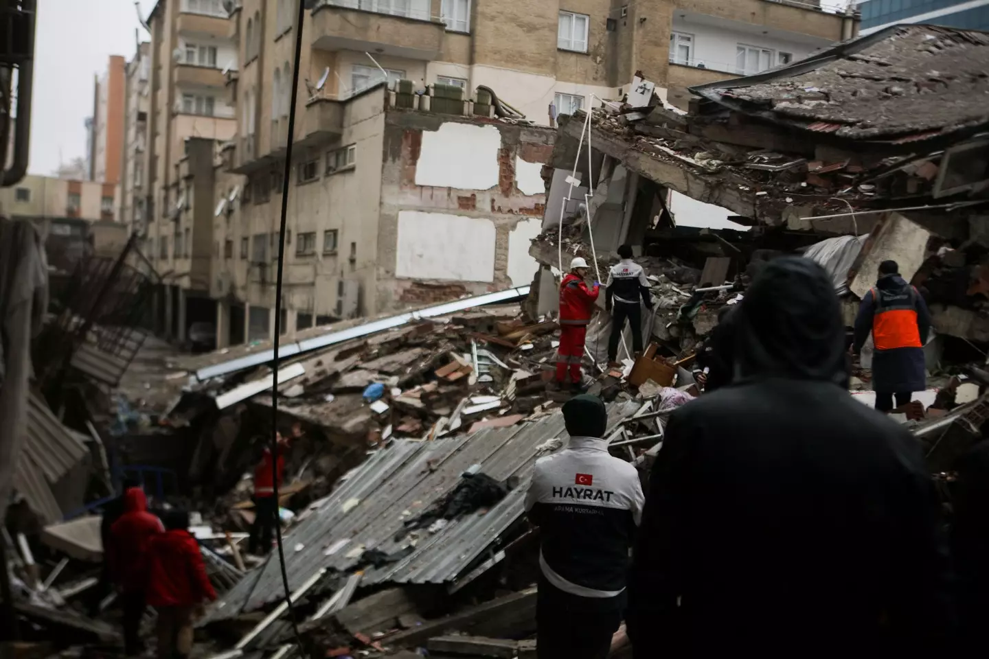 Rescuers operations are undertaken to save people trapped beneath the rubble.