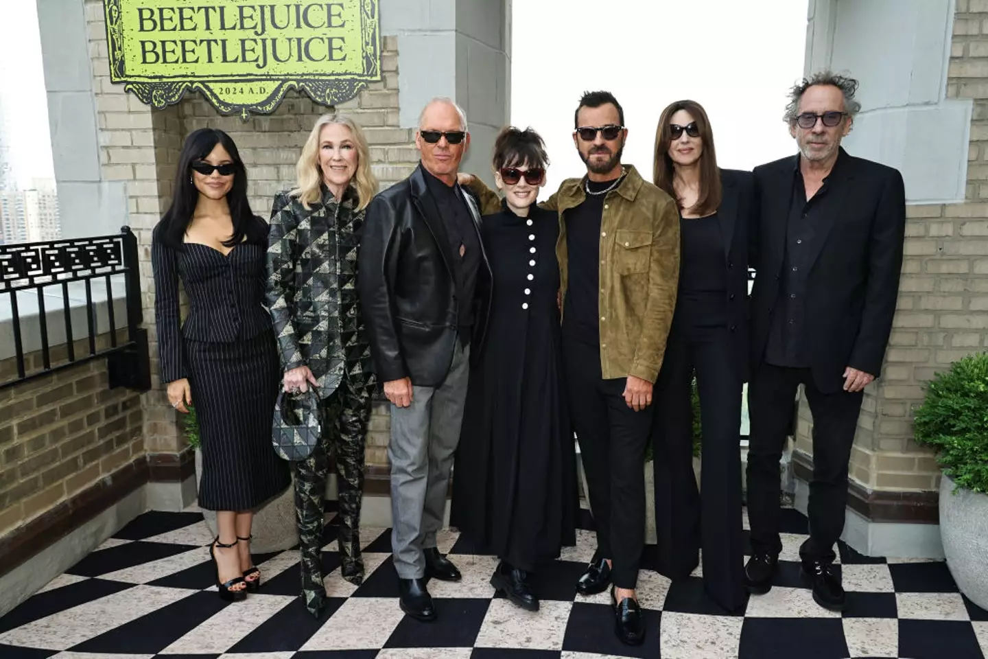 Jenna Ortega, Catherine O'Hara, Michael Keaton, Winona Ryder, Justin Theroux, Monica Bellucci and Tim Burton (Theo Wargo/Getty Images)