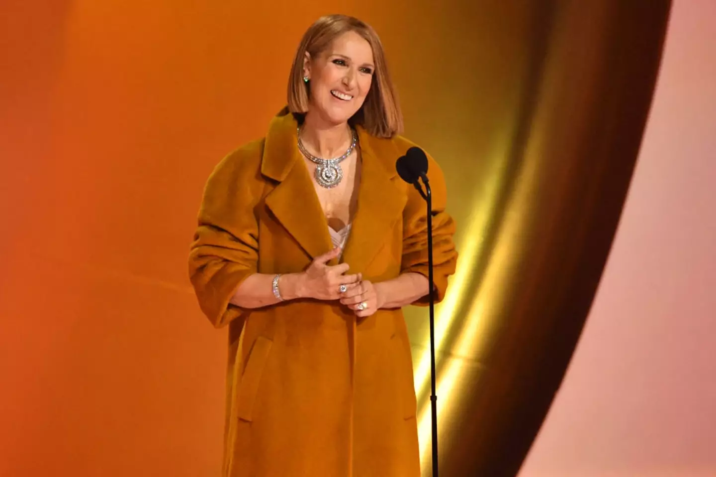 She was met with applause on stage. (VALERIE MACON/AFP via Getty Images)