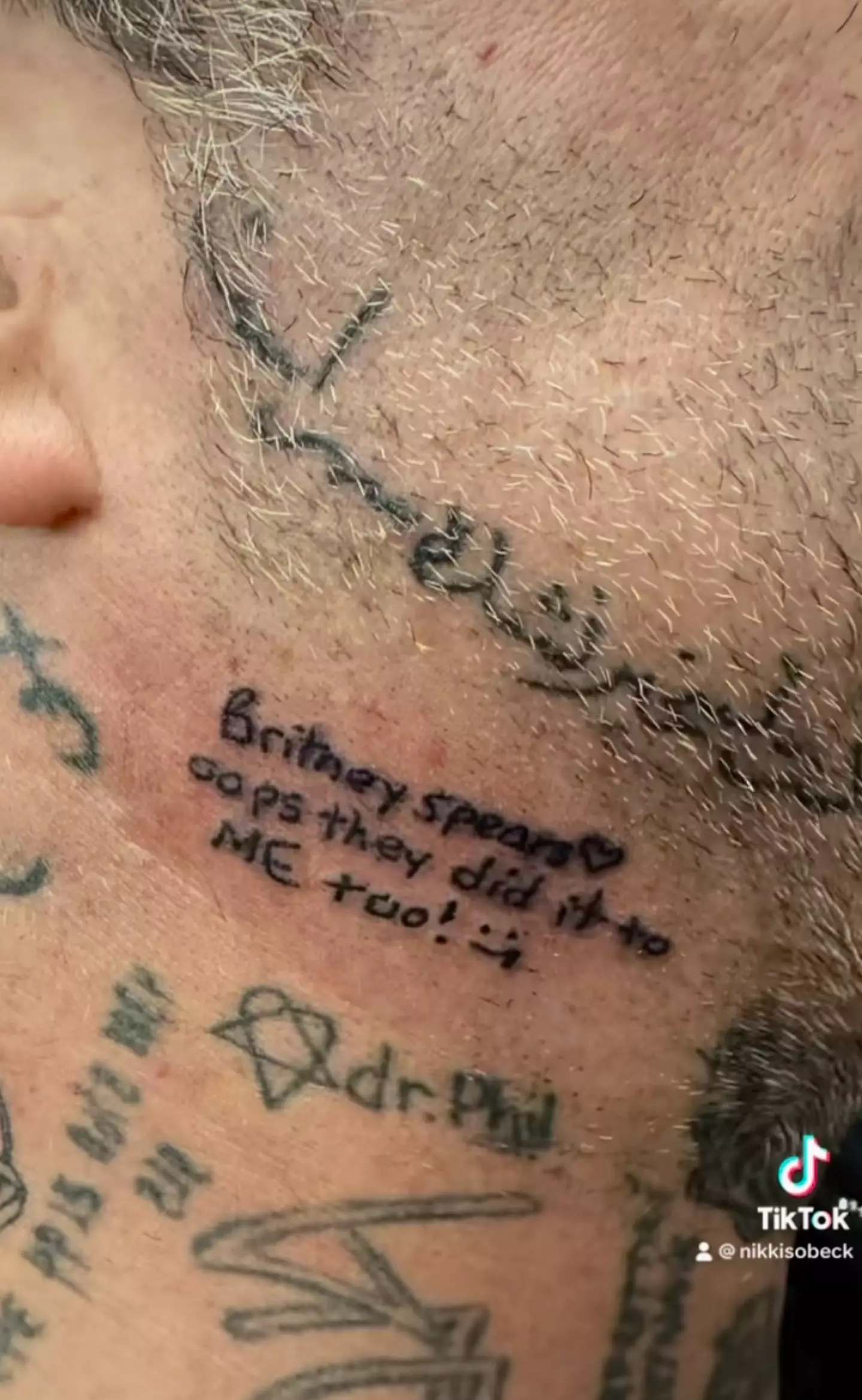 Bam's tattoo references Britney's hit song 'Oops I Did It Again'.