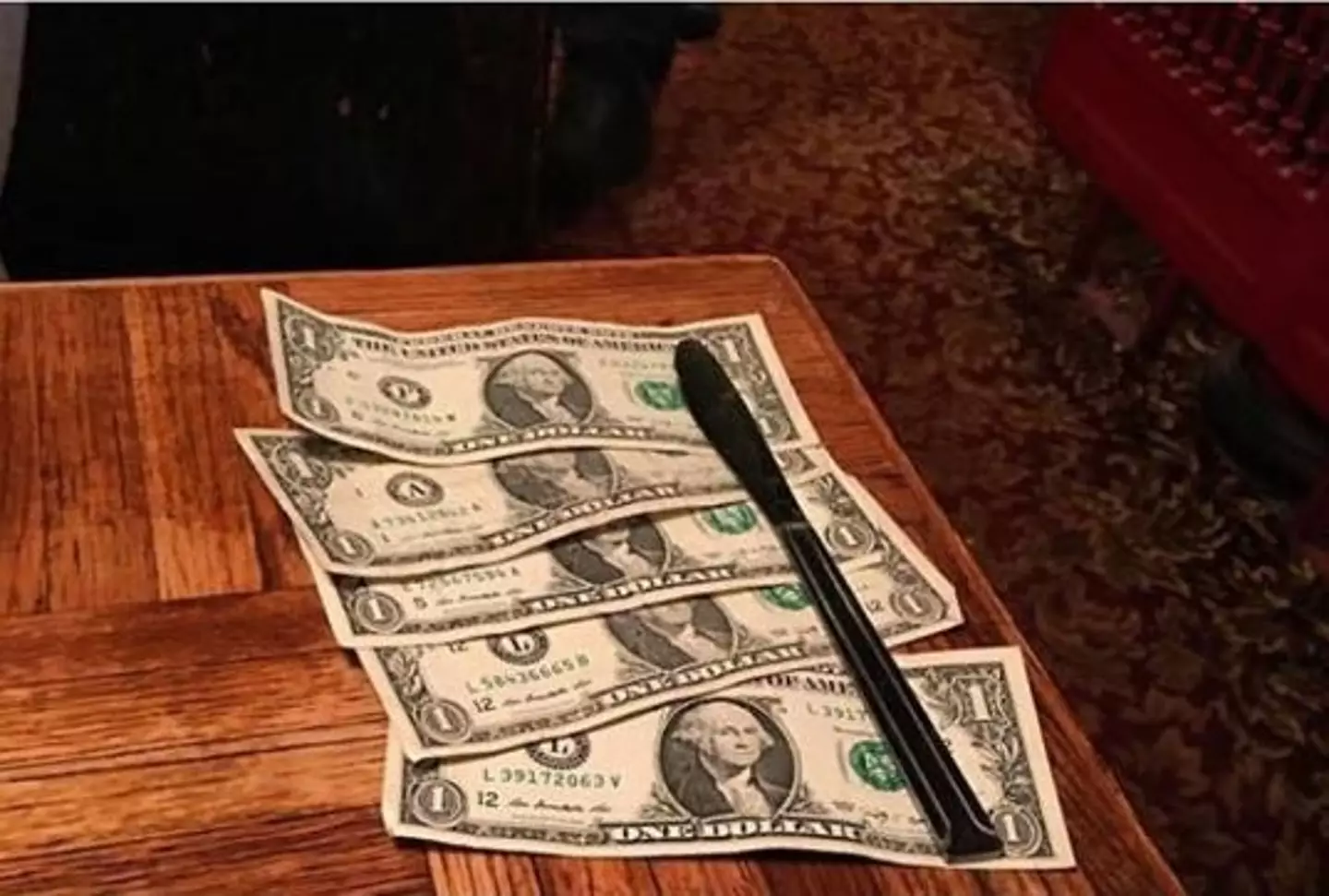 Pictured: $5 belonging to someone who definitely made their server fantasise about tipping their meal over their head.