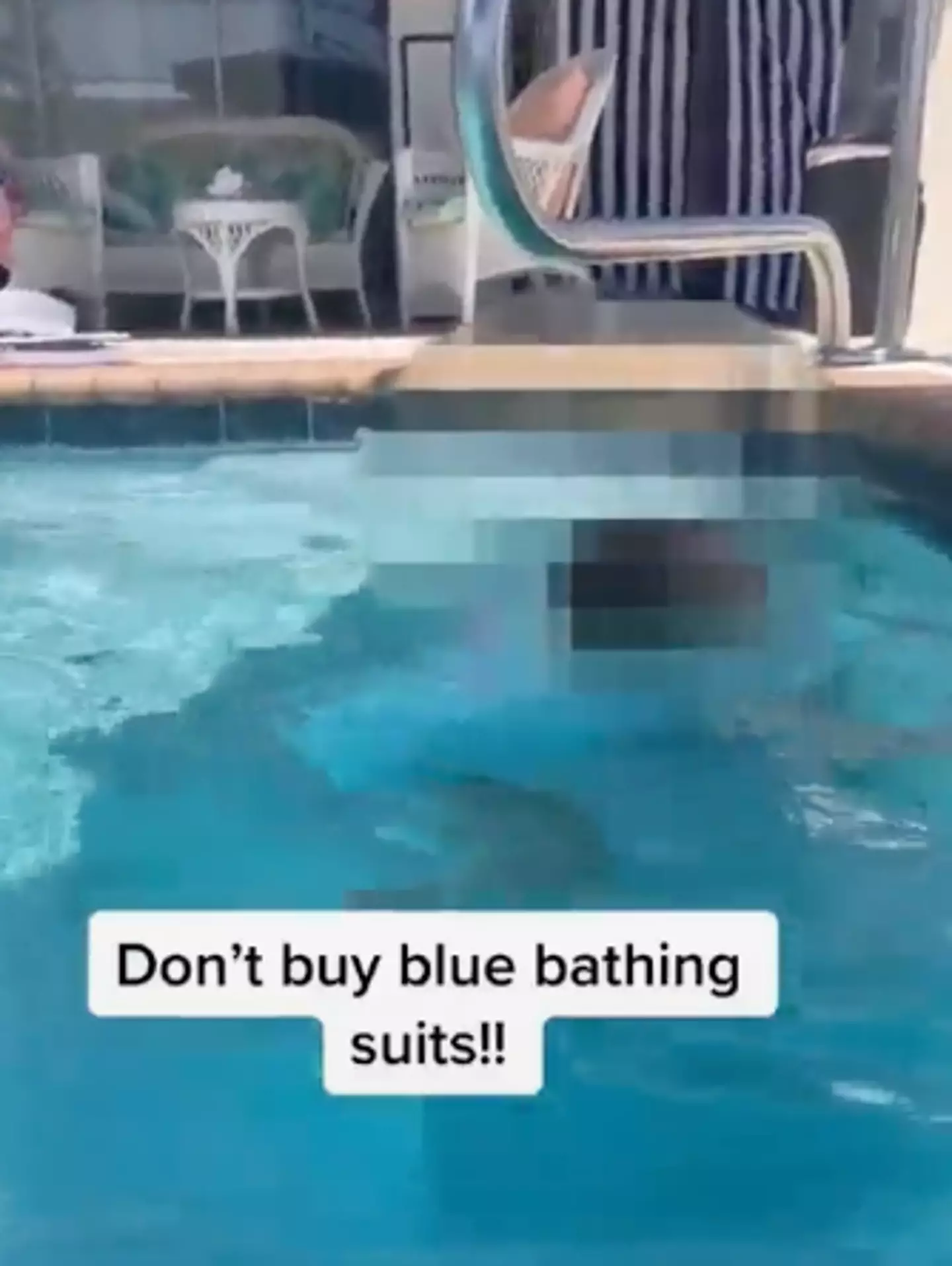 The instructor demonstrates the danger of children wearing a blue swimsuit with a video of her daughter.