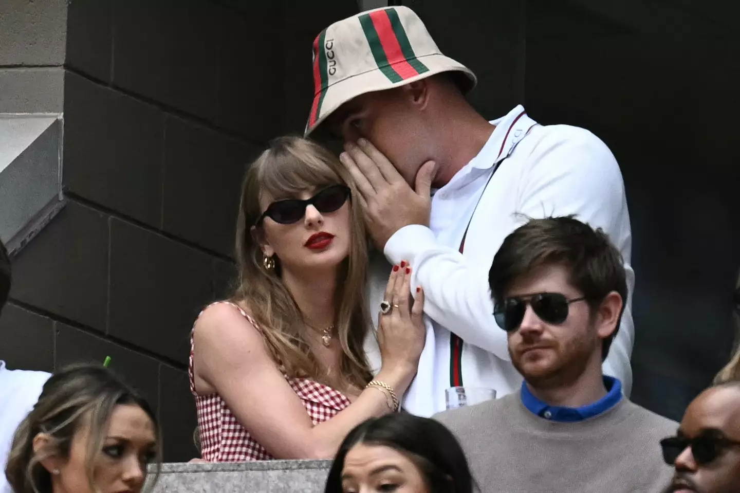What's Travis saying? (ANGELA WEISS/AFP via Getty Images)