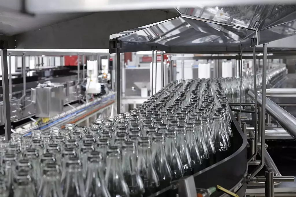 There's a reason why the drink tastes different in a glass bottle compared to a can (STEPHANE DE SAKUTIN/AFP via Getty Images)