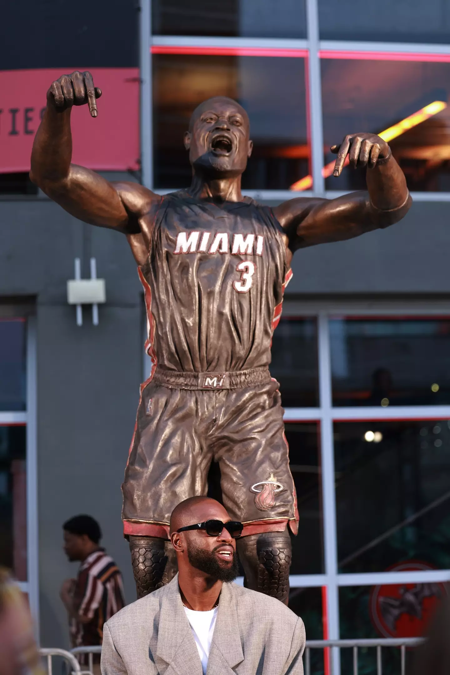 Wade in front of his statue (Carmen Mandato/Getty Images)