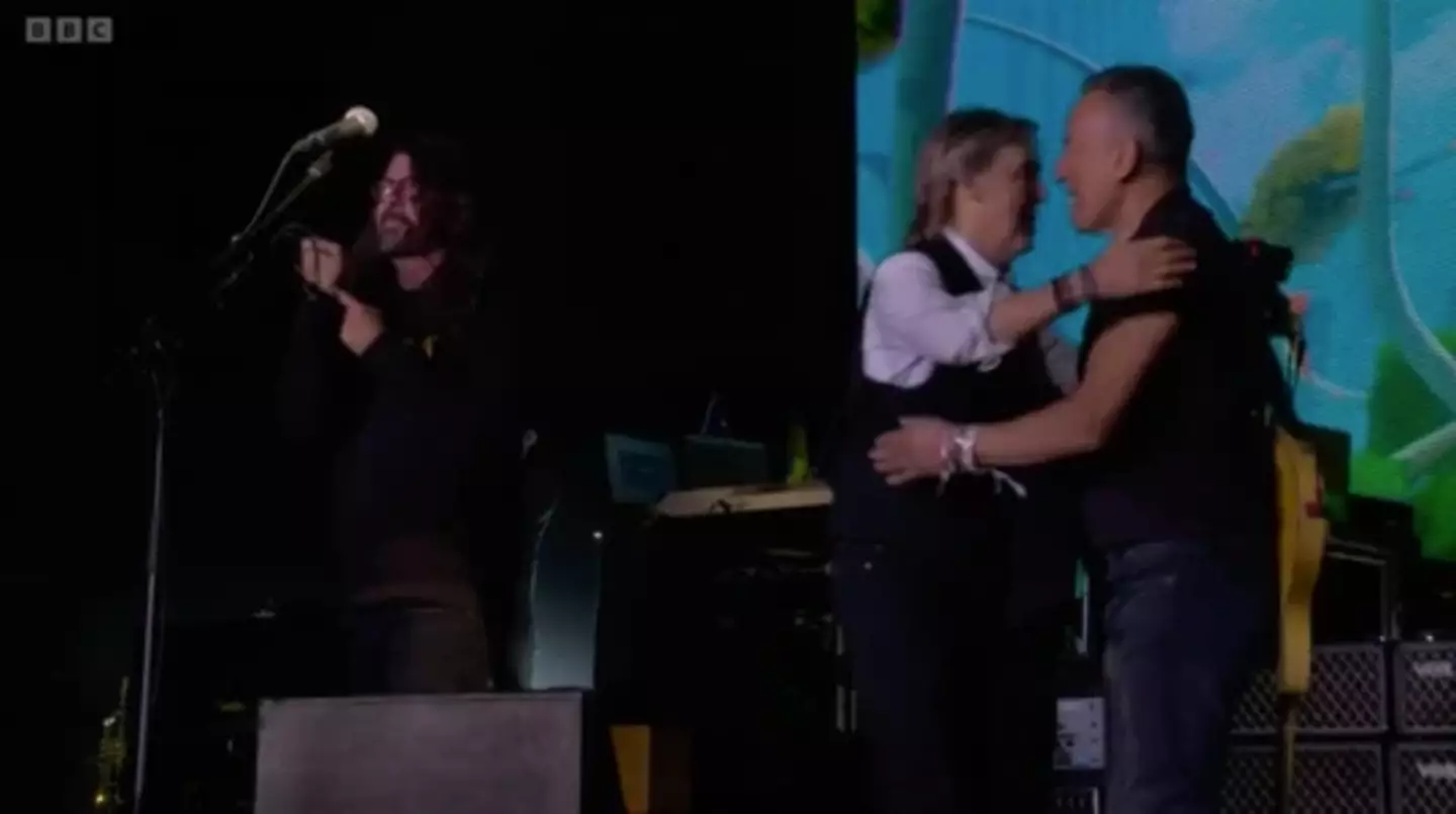 Grohl points to the tattoo at the end of McCartney's set.