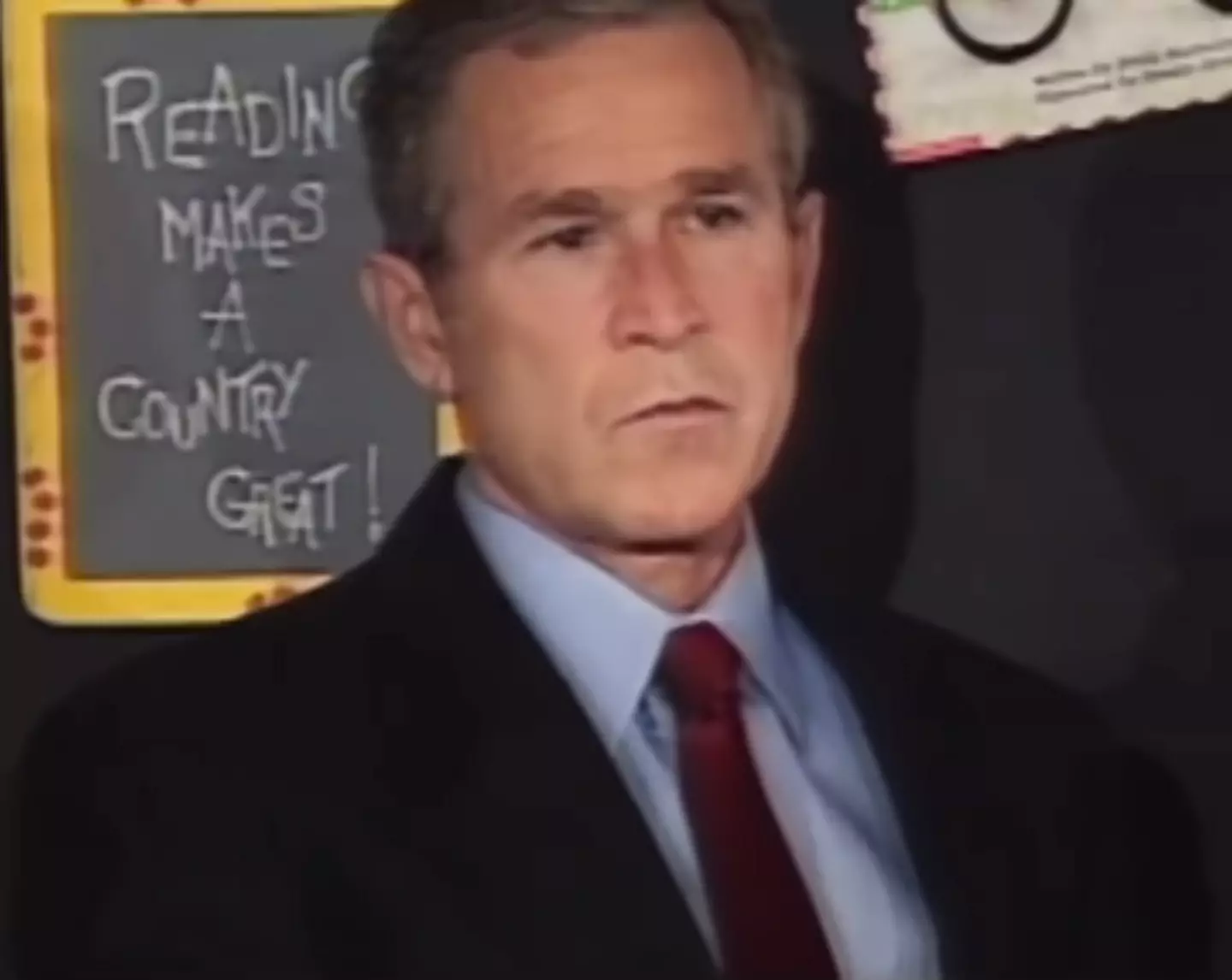 President George W Bush sat in the classroom as he was given the news.