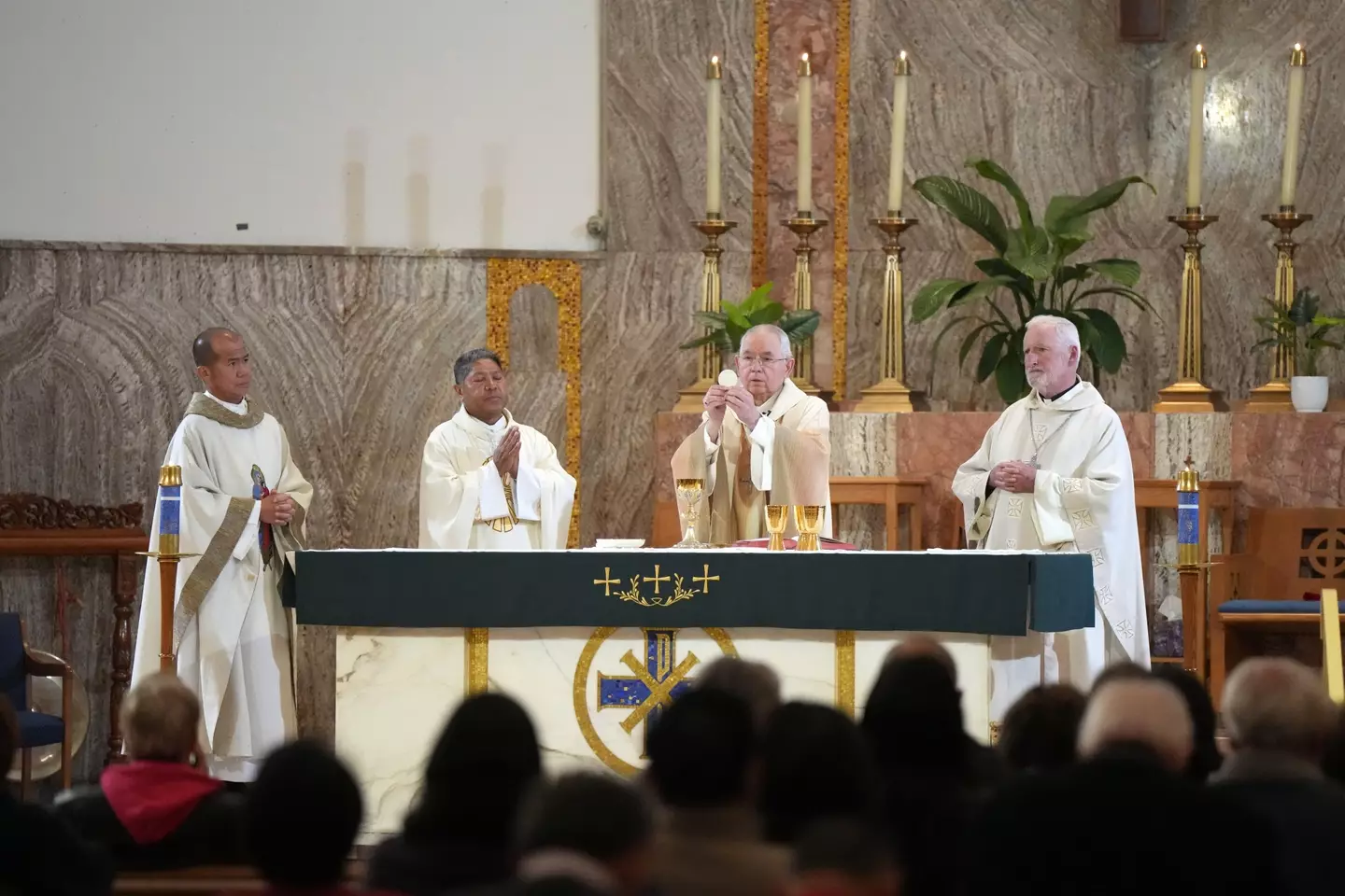 Bishop David O’Connell (on the end right) giving mass earlier this year.