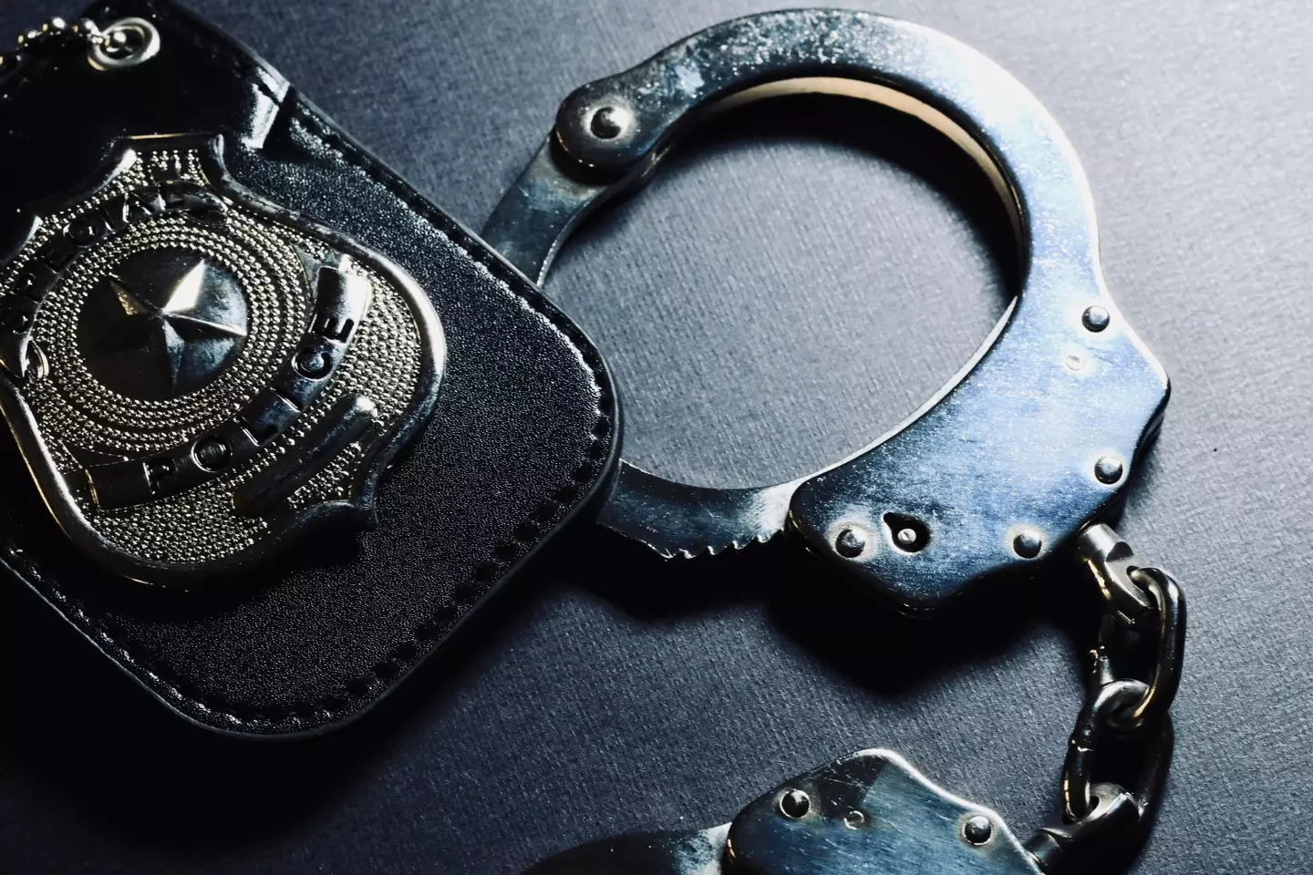 Police handcuffs and badge.