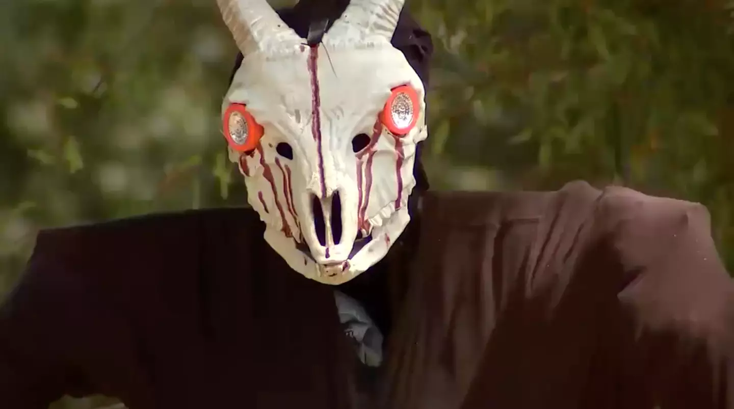 The decoration is a 'body' hanging from a tree.