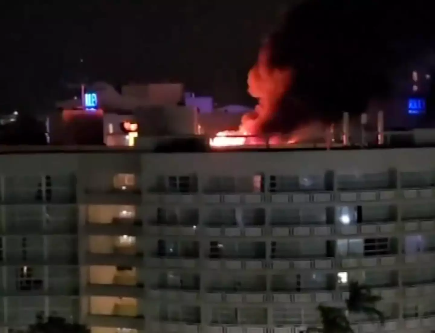 The roof of the hotel set alight in the crash. (7News)