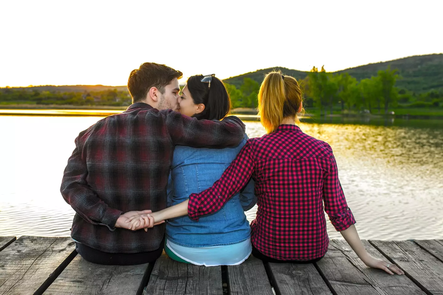 Redditor Mark is married to Emily, but the couple are also dating Sarah (Getty Stock)