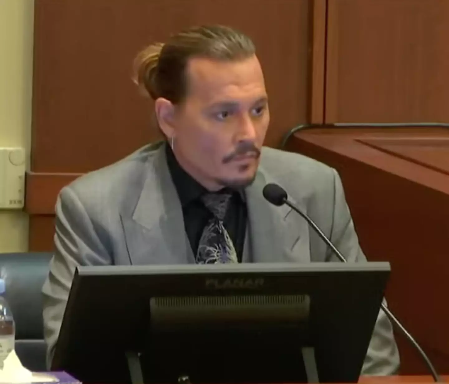 Depp giving testimony at his defamation trial against Amber Heard.