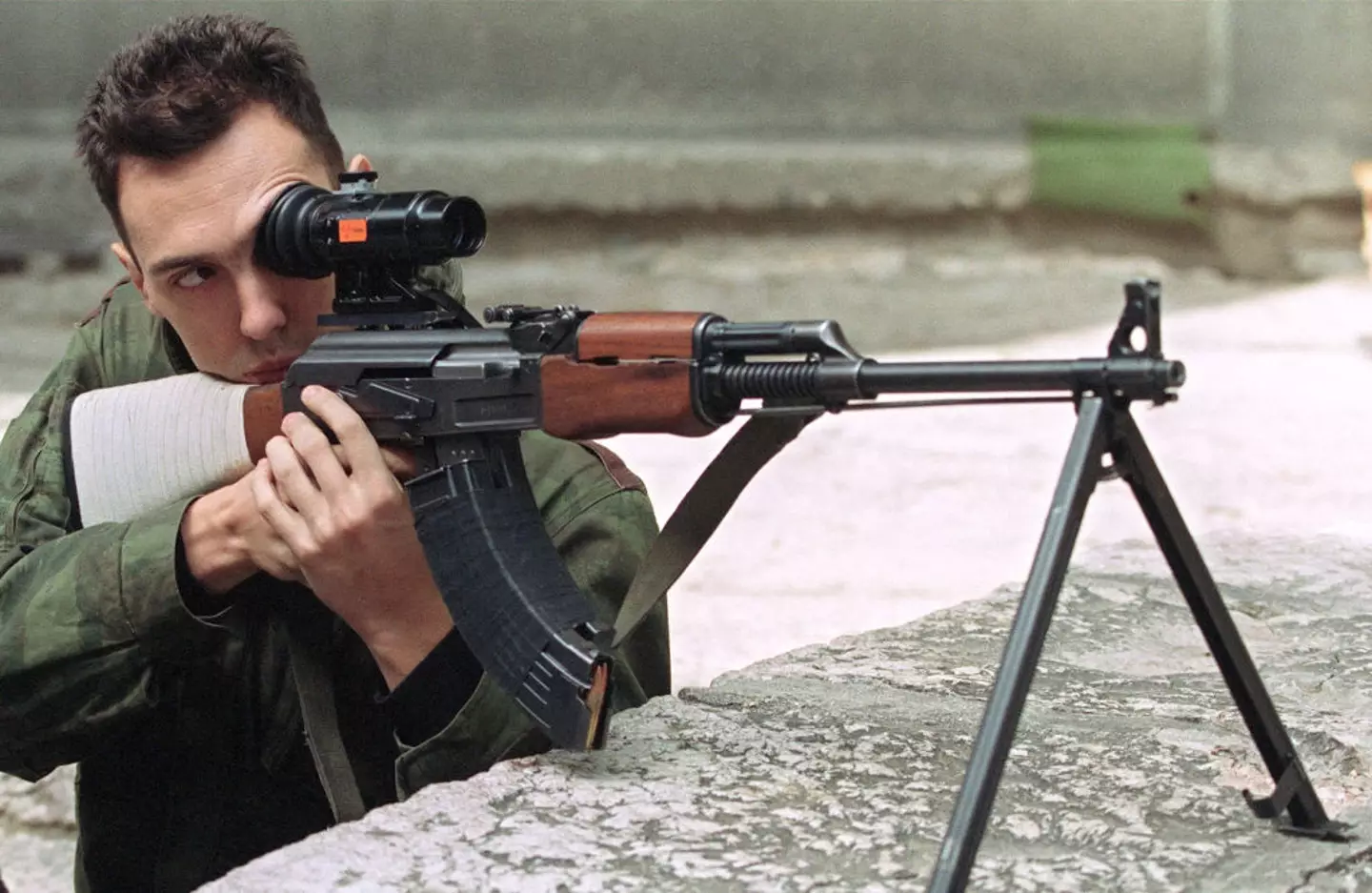 A sniper taking aim in Sarajevo (MICHAEL EVSTAFIEV/AFP via Getty Images)