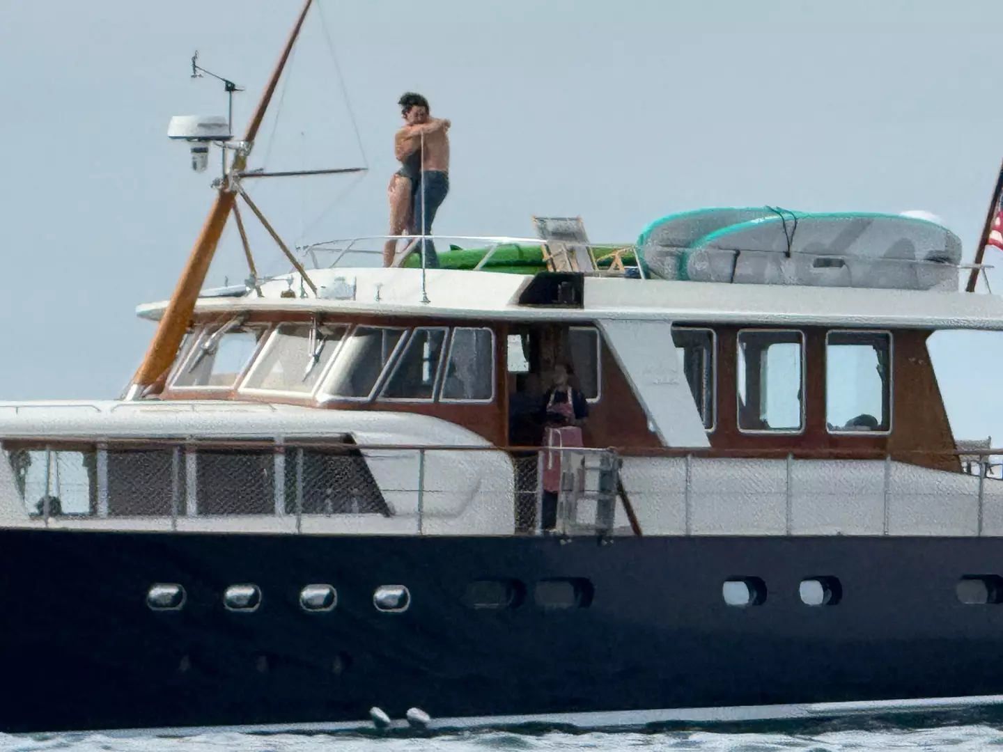 The pair shared an intimate moment on Perry's yacht (SWNS)