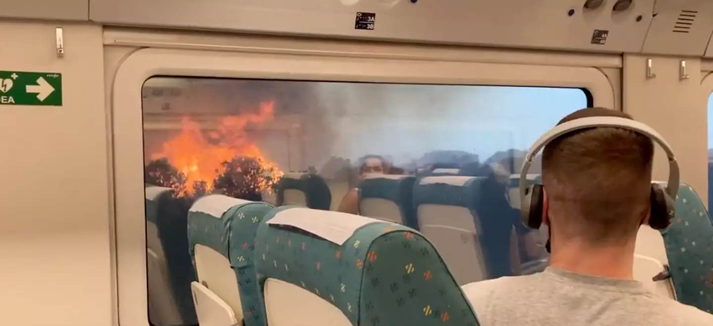 A train passenger travelling through Spain has captured terrifying footage of wildfires.