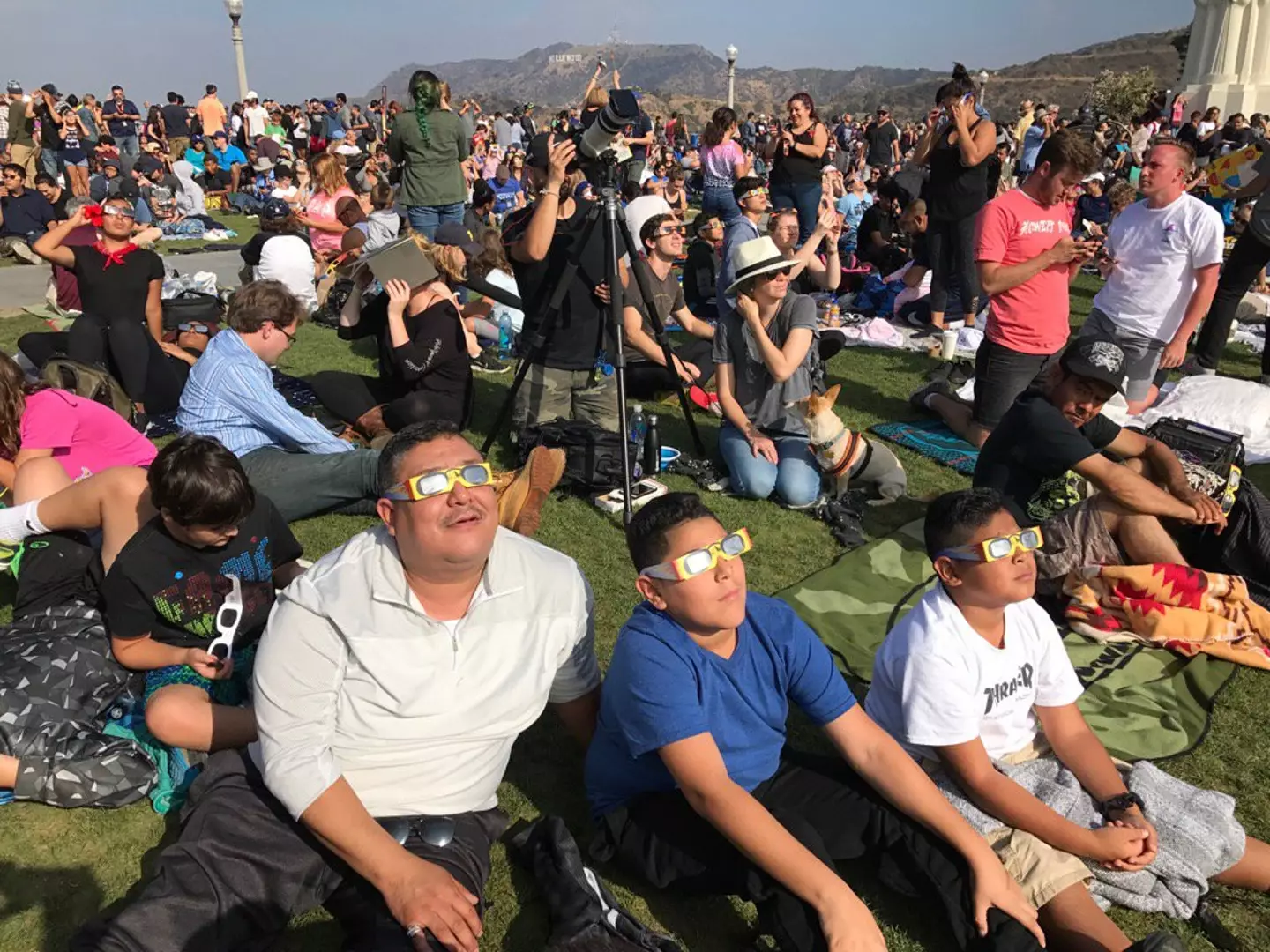 Solar eclipse fans watch the moon partially obscure the Sun Monday in August 2017.