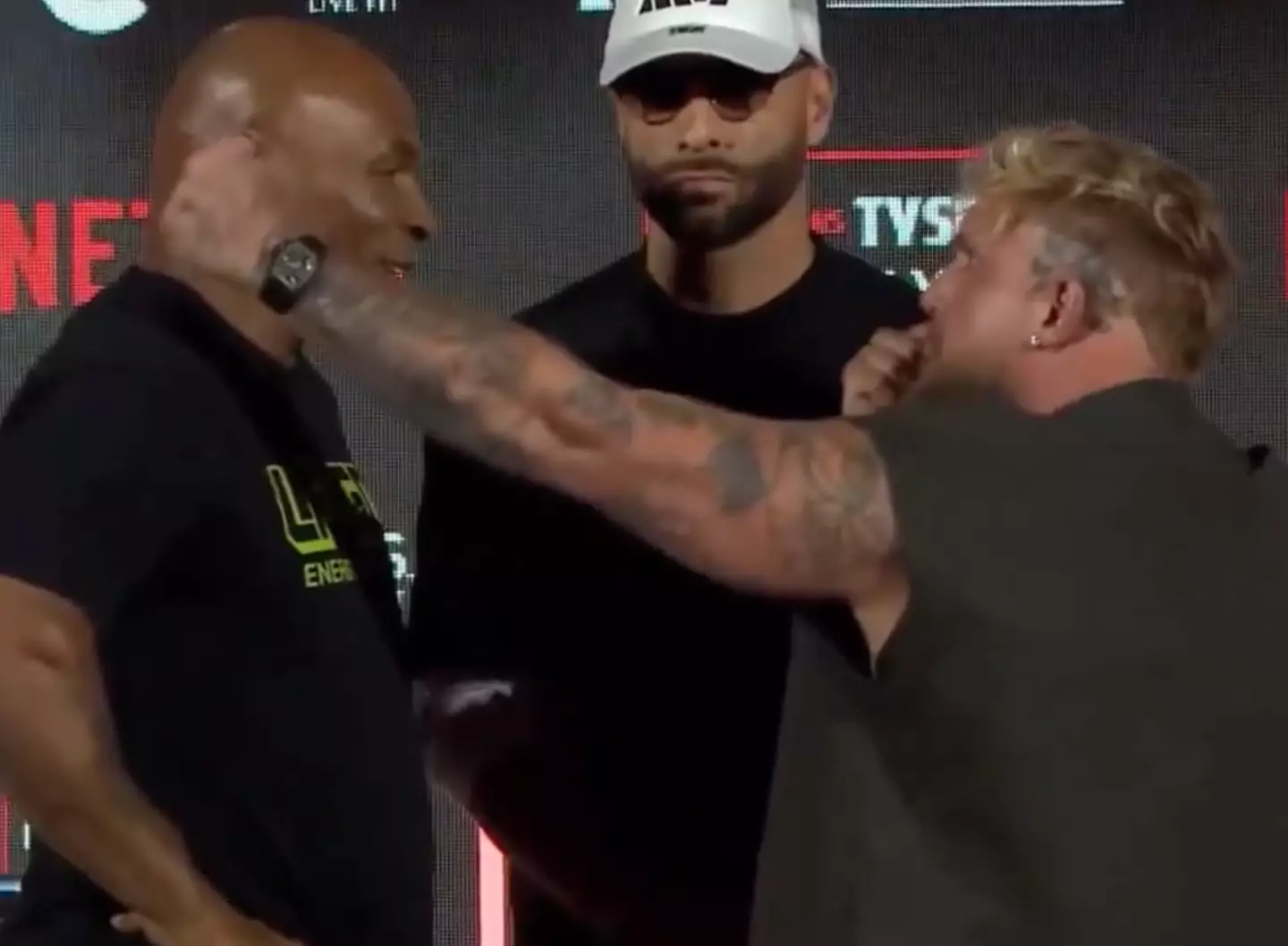 Paul continued to make hand gestures to the unphazed Tyson. (X)