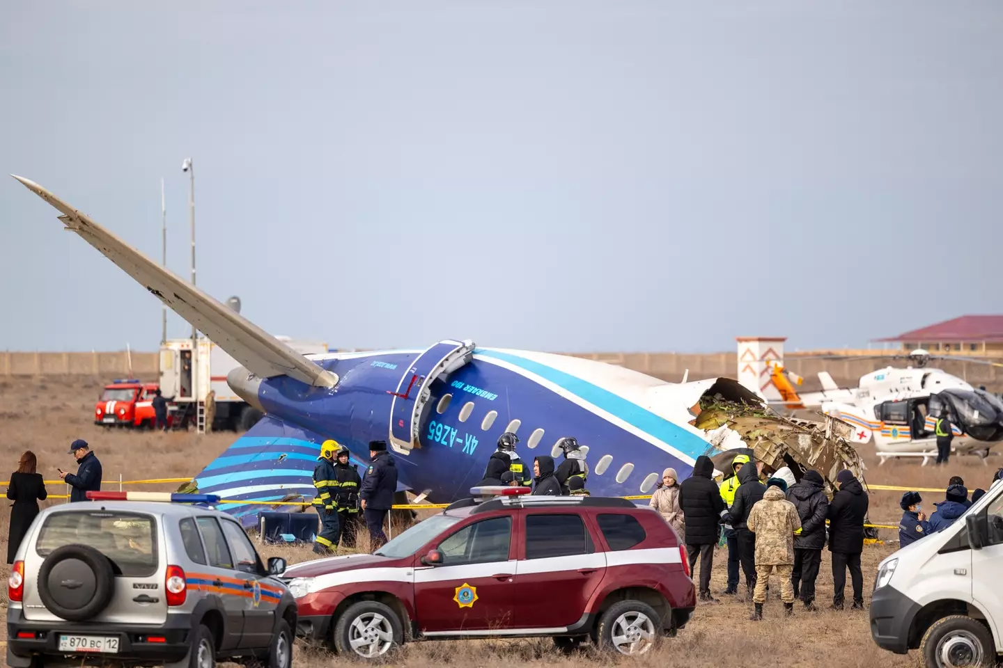 Emergency workers descended on the crash site (ISSA TAZHENBAYEV/AFP via Getty Images)