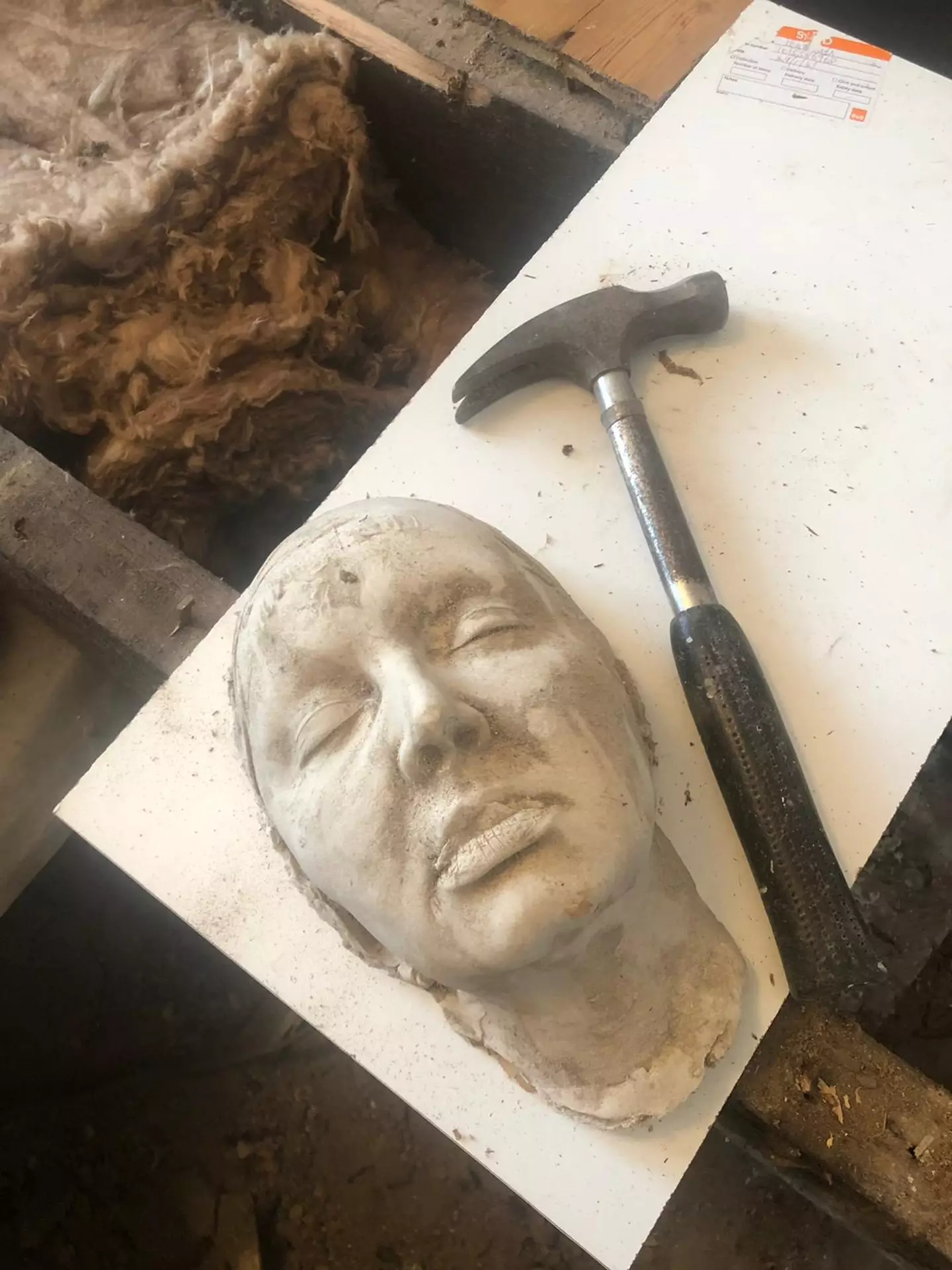 The couple found the death mask under the floorboards.