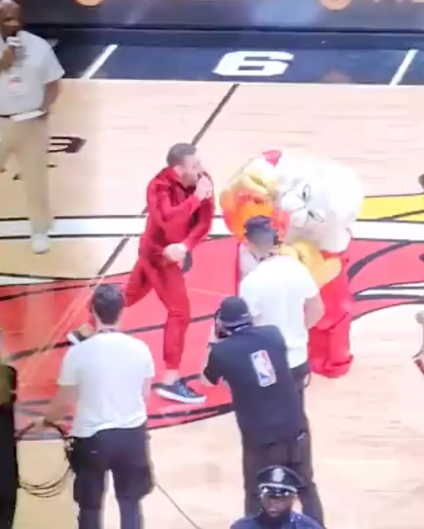 McGregor knocked the mascot off his feet.