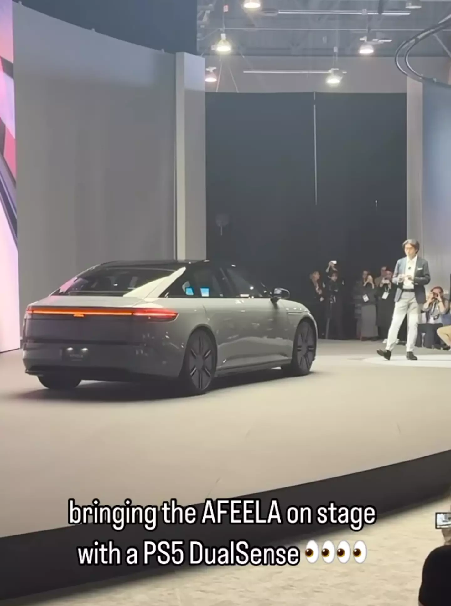 COO Izumi Kawanishi drove the car on stage using a PS5 controller.